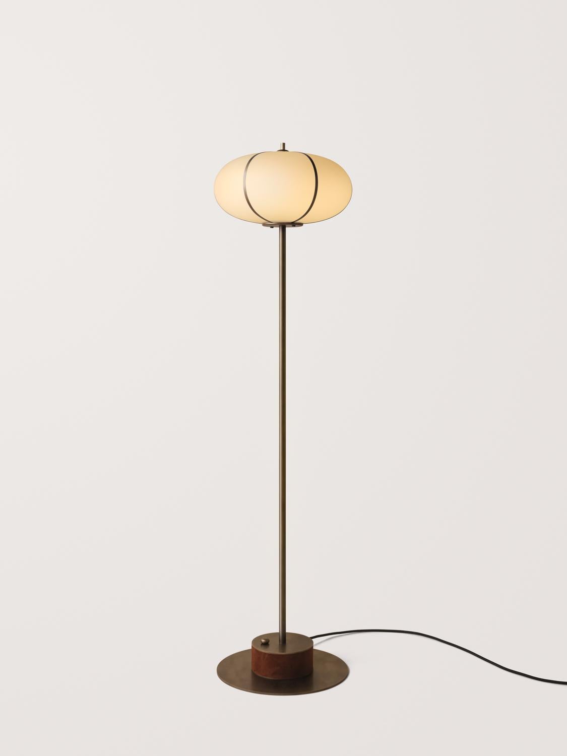 The Rib Floor Lamp Ellipse features glass blown in Italy and delicately framed by thin brass ribs. A cylindrical brass base is wrapped in leather or suede, enhancing the rich interplay of colors and textures.

Available in a variety of metal