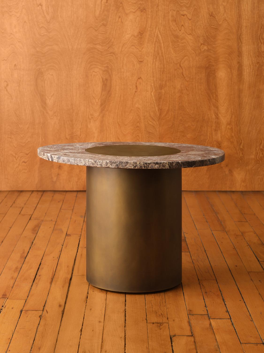 Inspired by the form and function of grain silos, the sculptural Silo Side Tables feature solid wood and hand-finished brass or stainless steel wrapped legs. Available in three sizes and height options to allow for various nesting