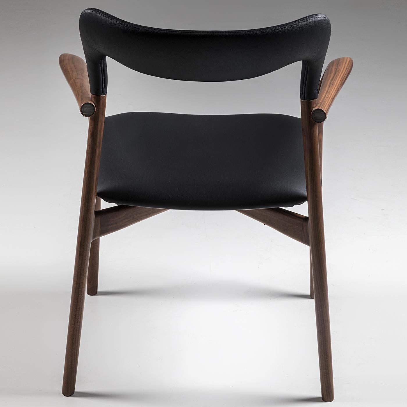Rising above any design trend, this armchair will make a statement in any interior decor, with its graceful lines and rounded edges highlighting the exquisite craftsmanship that characterizes the Kong Collection. Entirely crafted of dark-stained