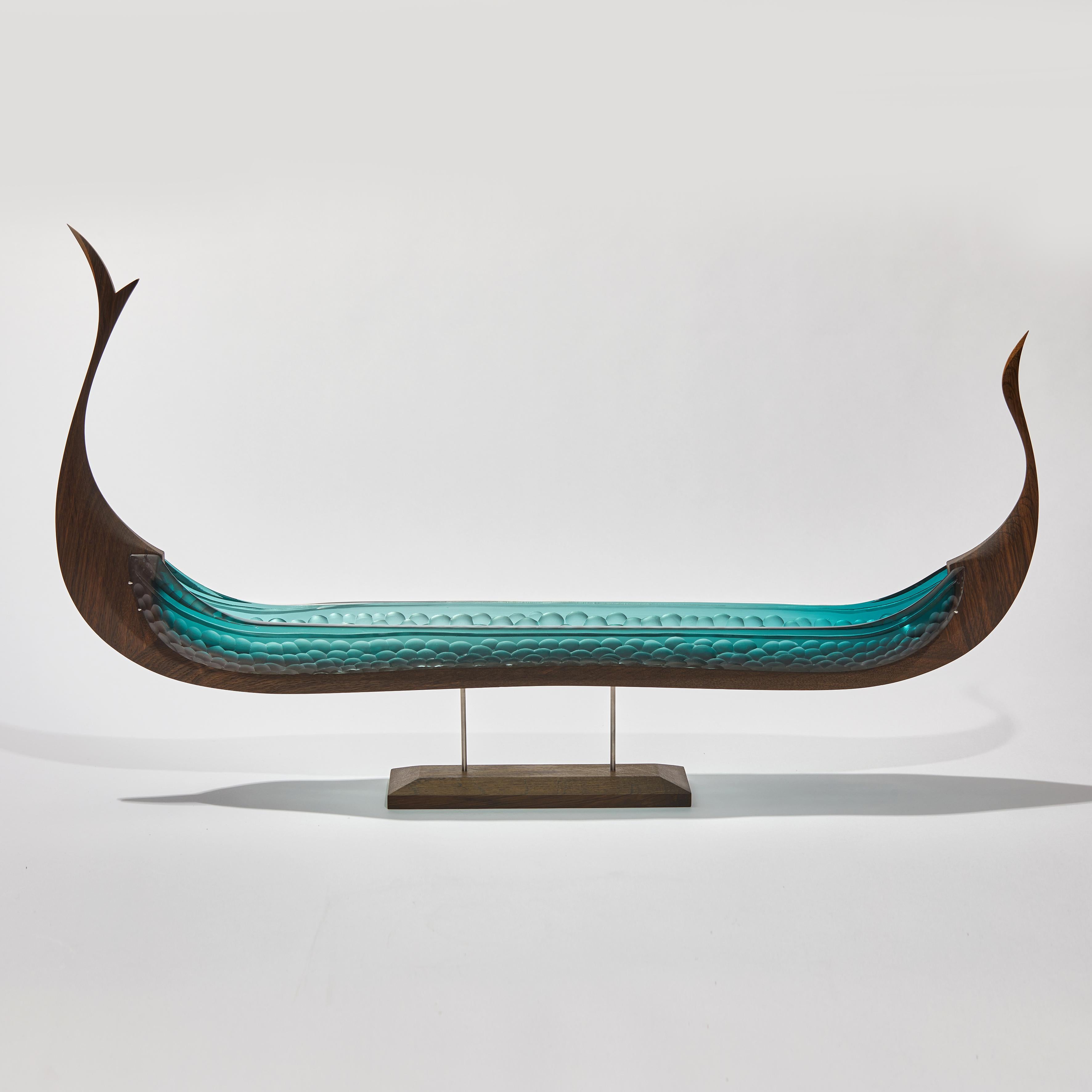 Fine cabinet making & crafted oak with handblown & cut jade glass combine to create this unique sculpture 'Konge' from the Glasskibe Collection. Created in collaboration by the Danish and British artists, Backhaus & Brown and Egeværk.

The title