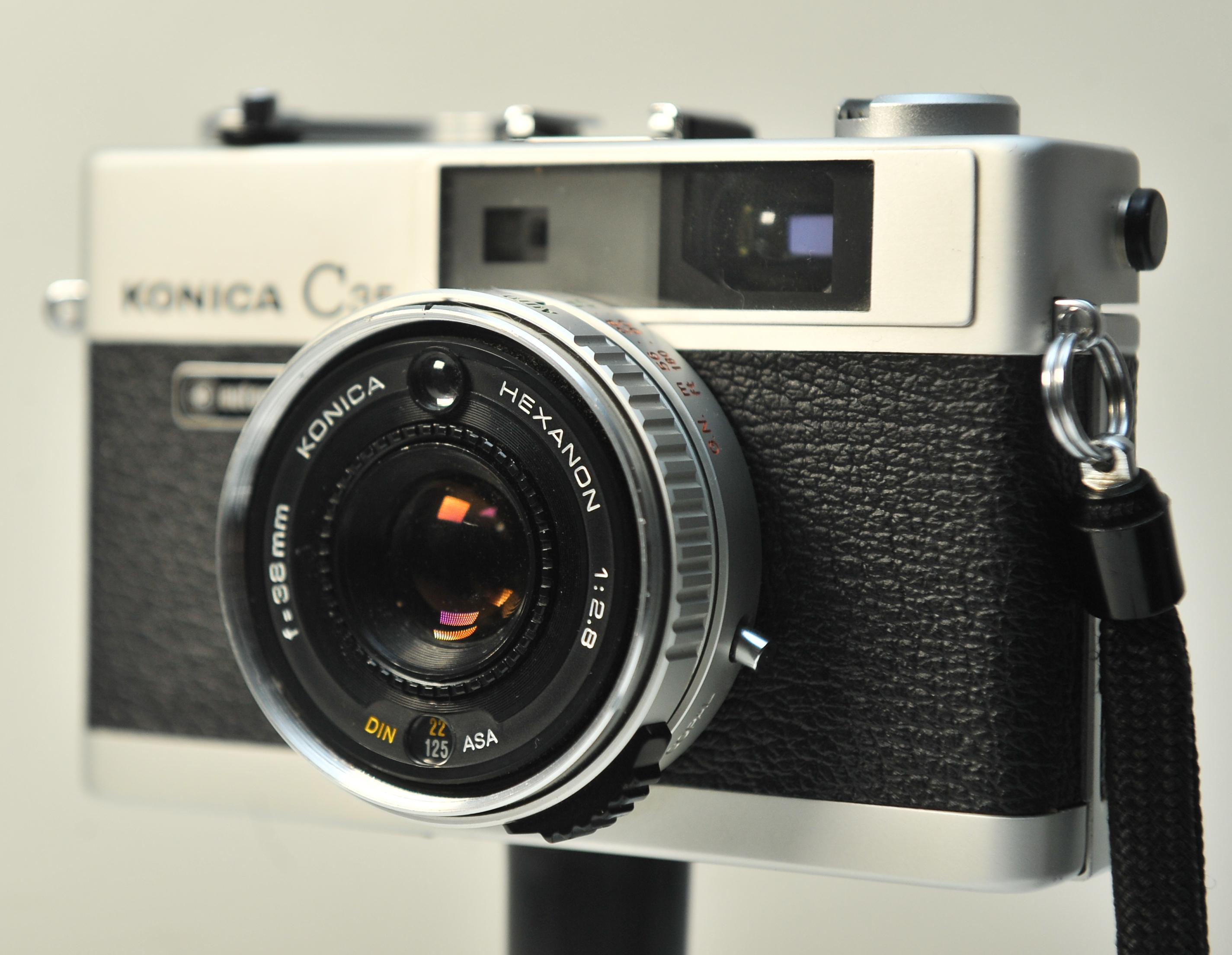 Mid-Century Modern Konica C35 Automatic 35mm Film Compact Rangefinder Camera with 38mm Hexanon F2.8 For Sale