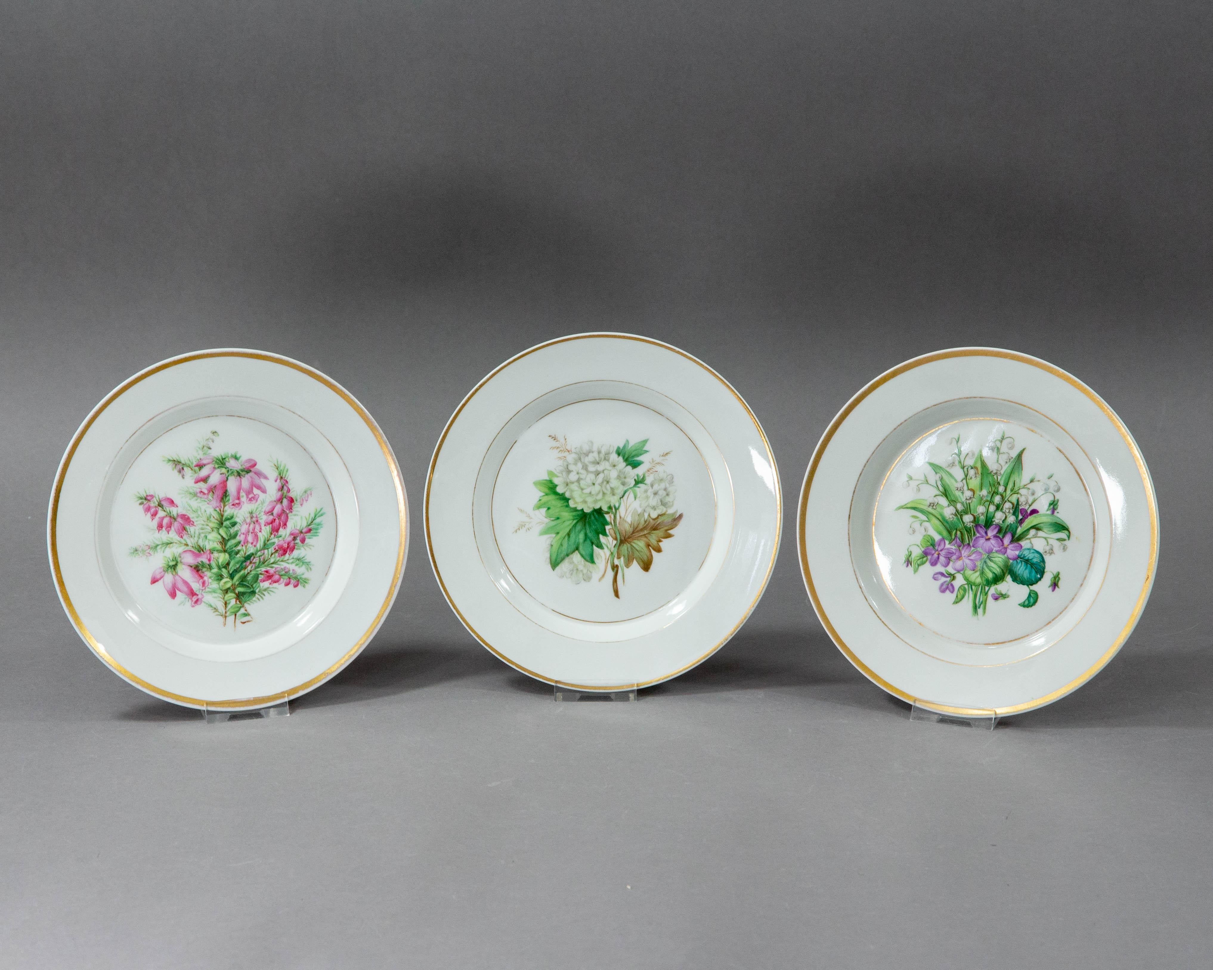 A set of beautiful porcelain plates made at the Königliche Porzellan Manufaktur in Berlin in the 1860s.

The set consists of three plates with gold rims and hand painted botanic decorations. 

The plates have consistent marking in underglaze