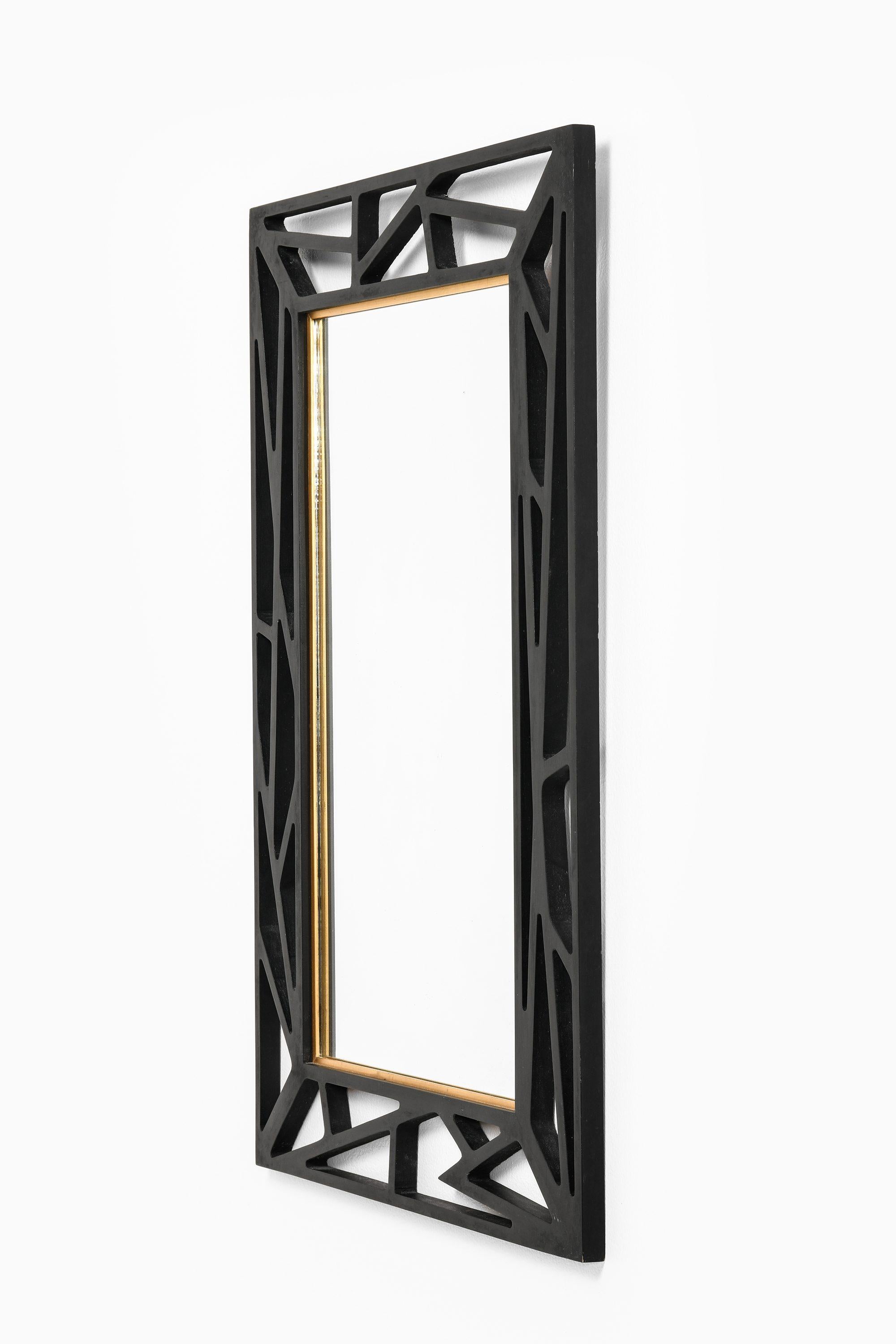 Konkret Mirror in Black Lacquered Wood Attributed to Yngve Ekström, 1950's

Additional Information:
Material: Black lacquered wood
Style: Mid century, Scandinavian
Produced by Eden spegel in Sweden
Dimensions (W x D x H): 55.5 x 2 x 83 cm
Condition: