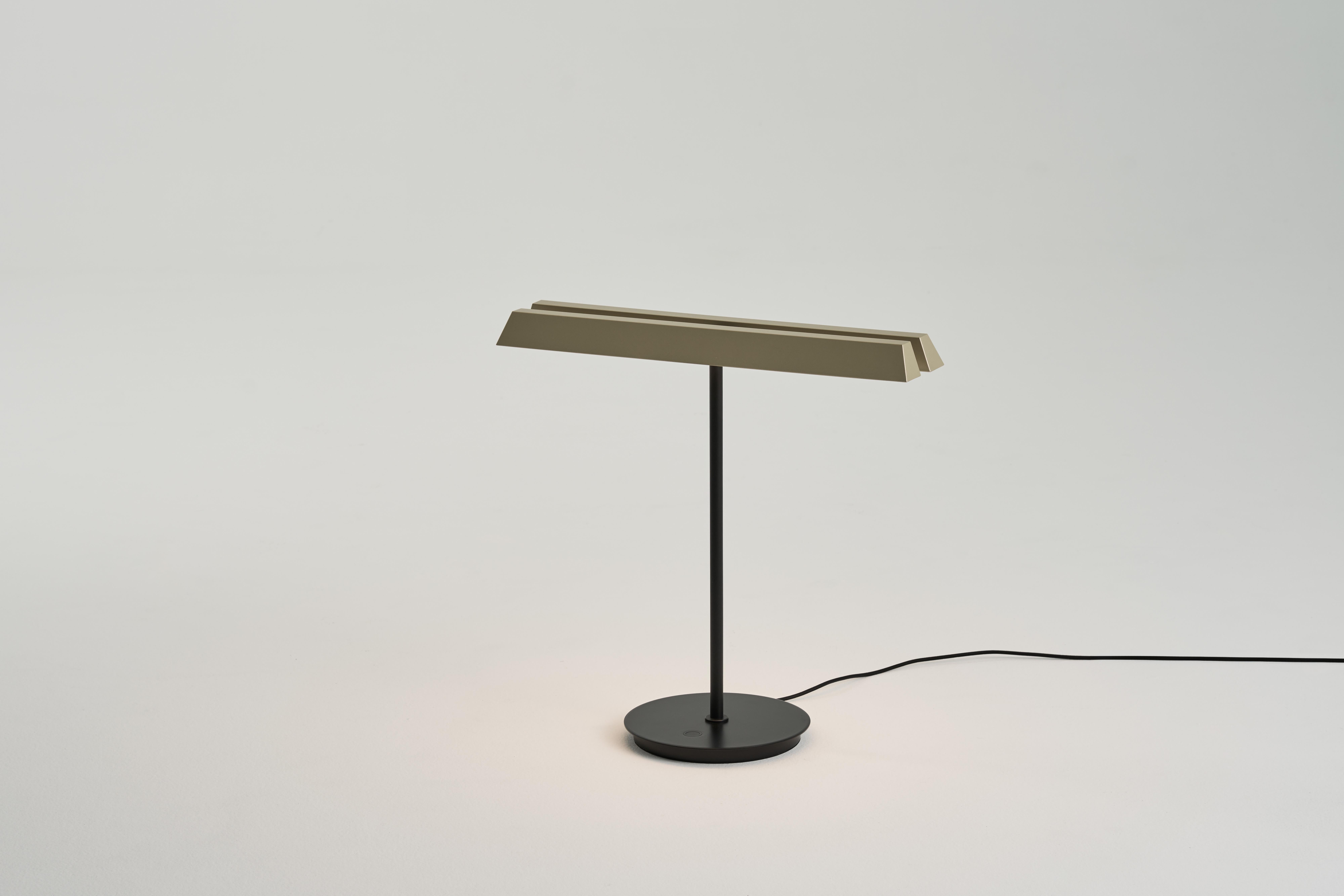 Influenced by modernist architecture, the KONNECT Table Lamp displays light in multiple ways between functional illumination and customizable art decor – arrangements of panel-based LEDs that set the mood you want to create a distinctive lighting