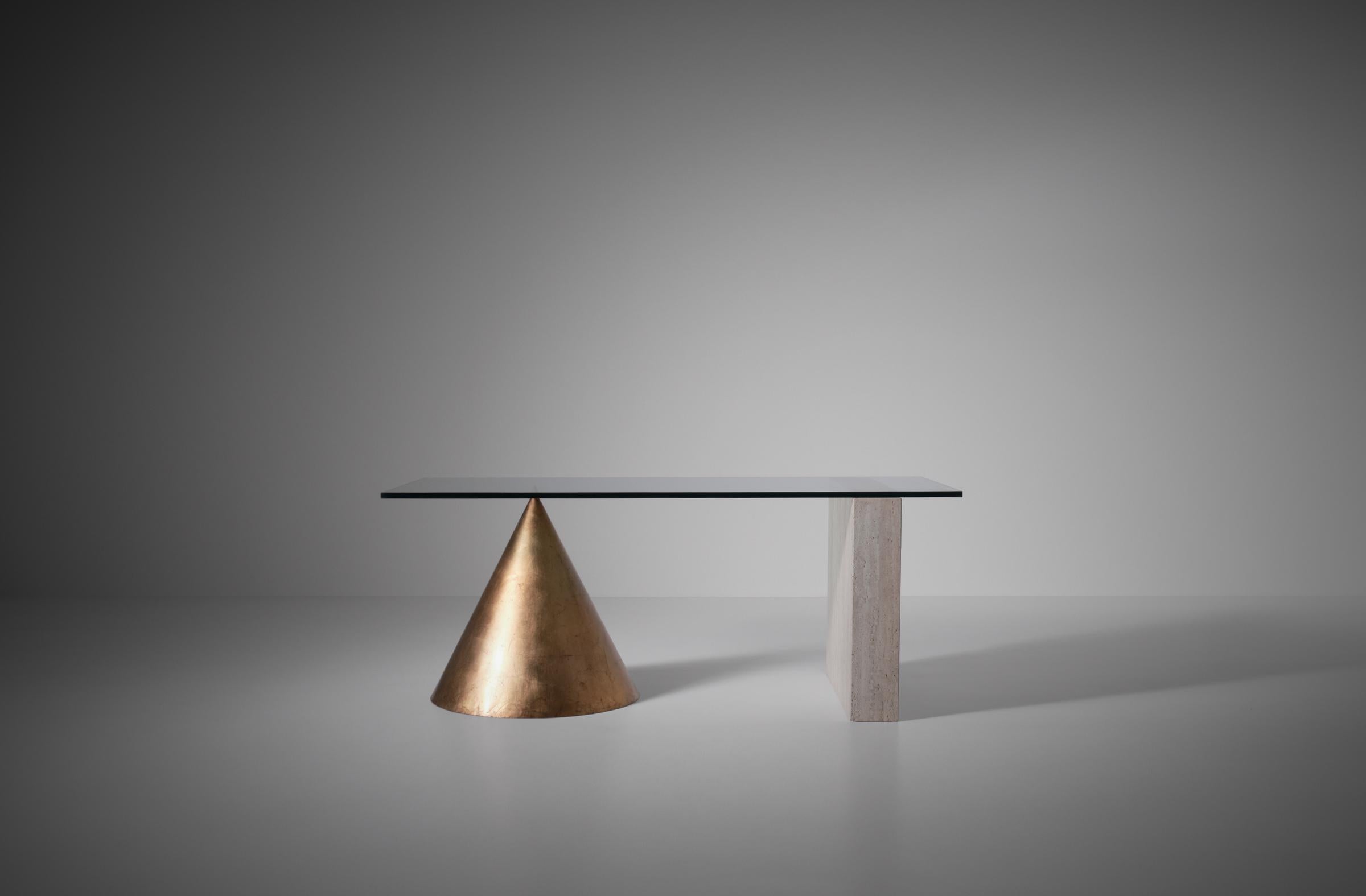 Iconical ‘Kono’ dining table by Lella & Massimo Vignelli for Casigliani, Italy 1984.
This rare version in guilded copper is stunning as a dining table and can be very nice as a center piece or sculptural desk as well. The Kono table has a glass top