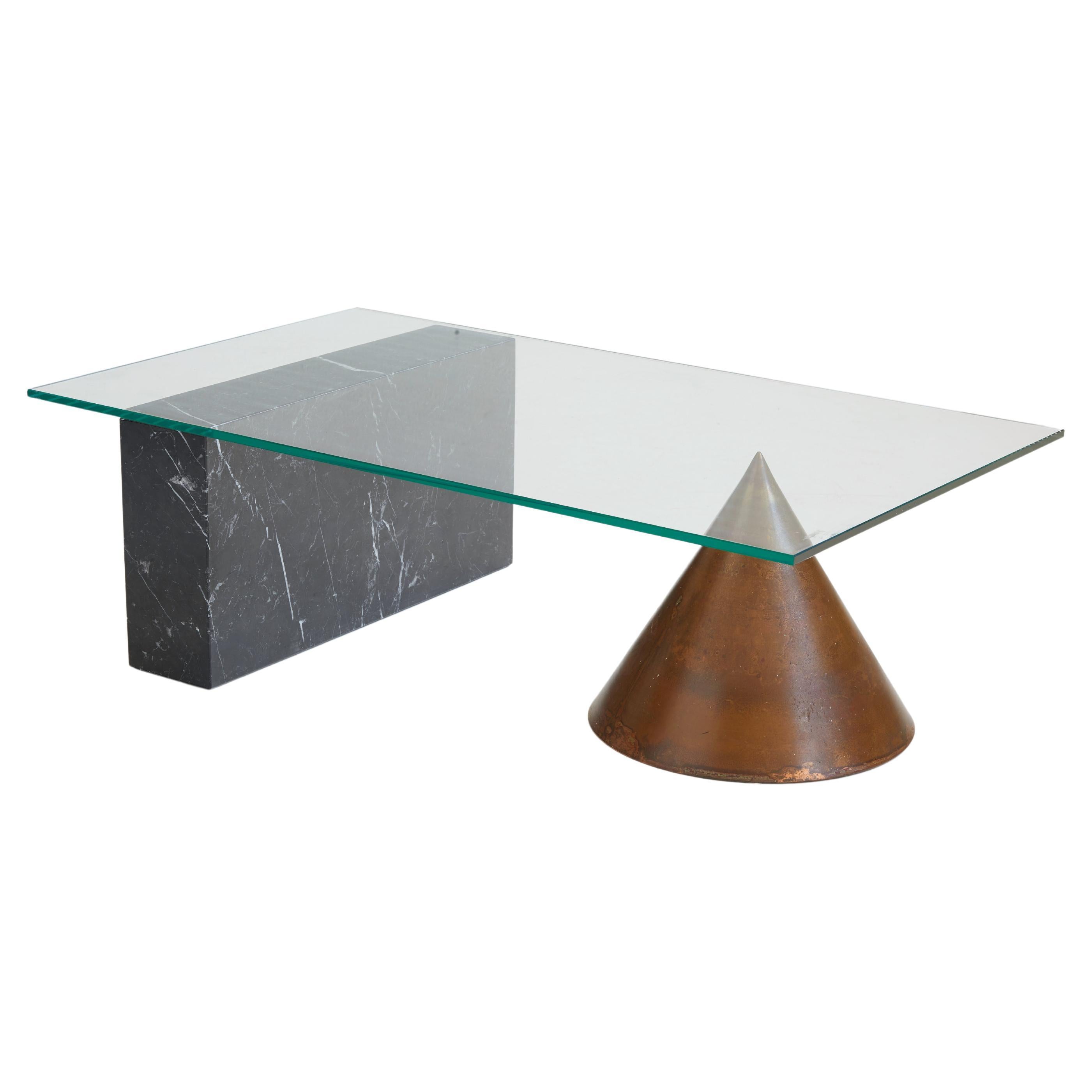 Iconic and rare Kono coffee table by Massimo and Lella Vignelli for Casigliani, Italy 1983.

This stunning piece marries contrasting geometrical shapes and materials with great finesse.

A sleek, rectangular block of Nero Marquina marble harmonizes