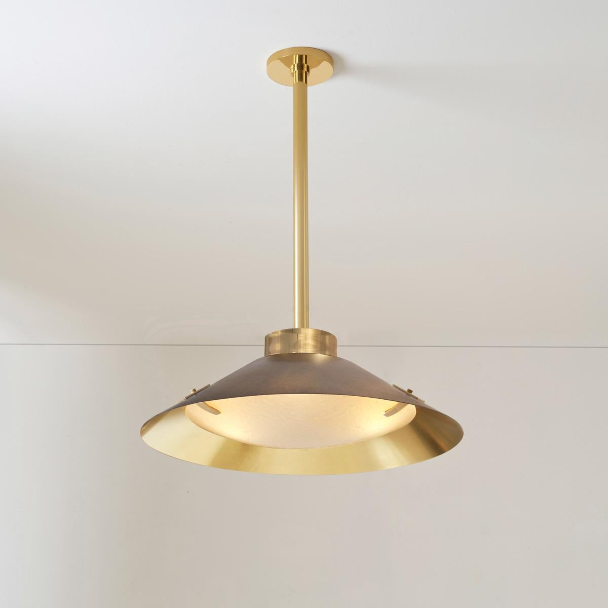 The Kono ceiling light is inspired by time tested shapes and lines but has a touch of organic modern via the incorporation of our signature Murano Bubble glass. With a mix of classic and contemporary, a two-tone shade with many color combinations