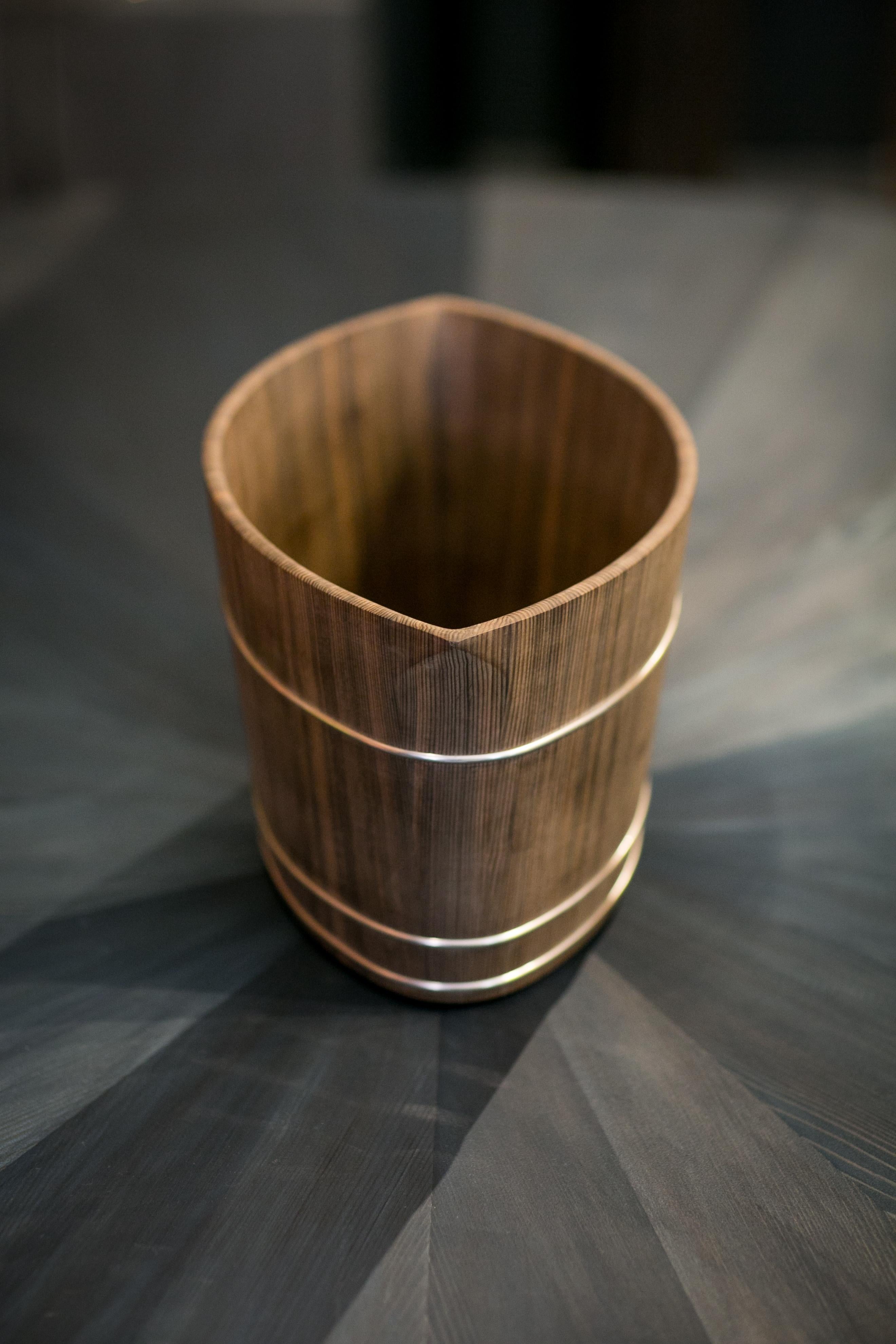The beauty of precious Japanese wood meets the tradition of exquisite craftsmanship in this unique champagne cooler. Handcrafted in Japan by Shuji Nakagawa, the object conveys utter-discipline in the making and elegance in its subtle