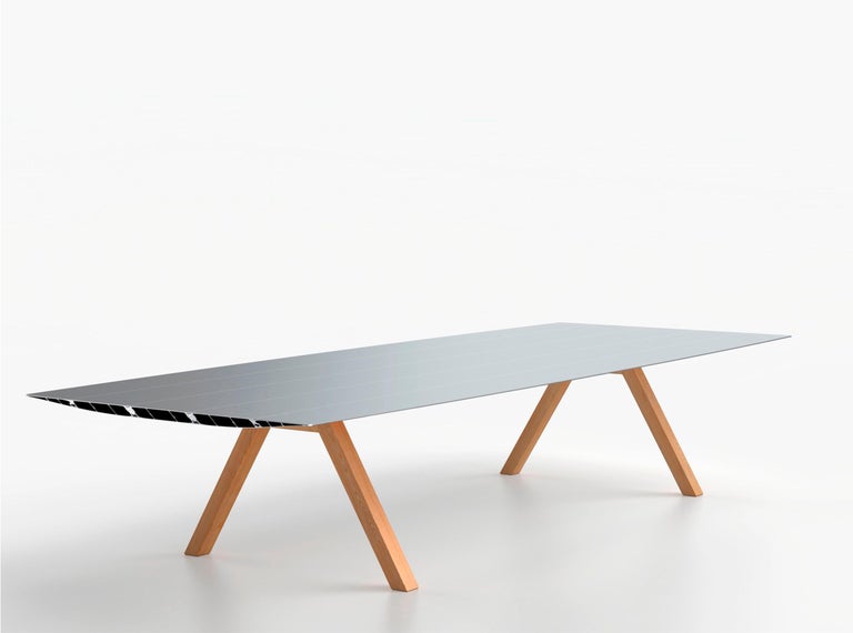 B-150 Table, in extrusioned aluminium with natural oak legs. 

Designed by Konstantin Grcic in 2021, manufactured by BD Barcelona.

Konstantin Grcic opened the Extrusions collection with the Table B, in 2009. Grcic has been inspired by classic