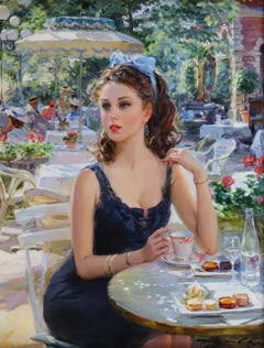 Lady in a blue dress, seated at a Paris café                                    