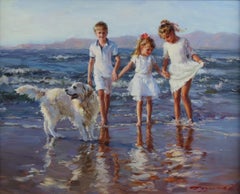 Young Girls and a Boy Playing on a Beach with a Labrador
