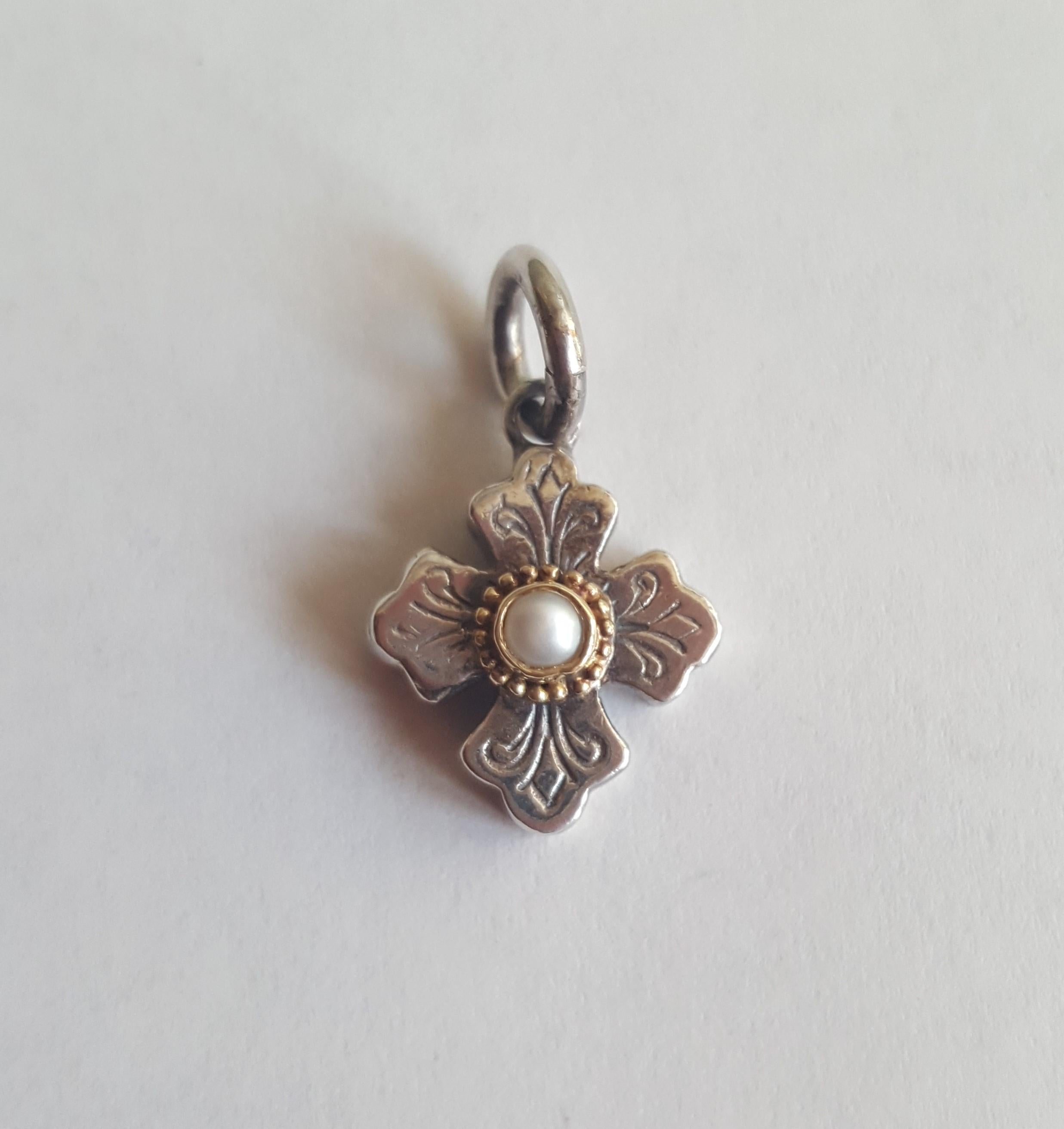 Konstantino Cross Pendant Charm, Silver and 18kt Yellow Gold with White Pearl, 16mm x 14mm Size, 4.8 Grams, Stamped 750/925, 7mm Jump Ring.
This cross can be used as a pendant or a charm. Please let us know if you have any questions.
chain sold