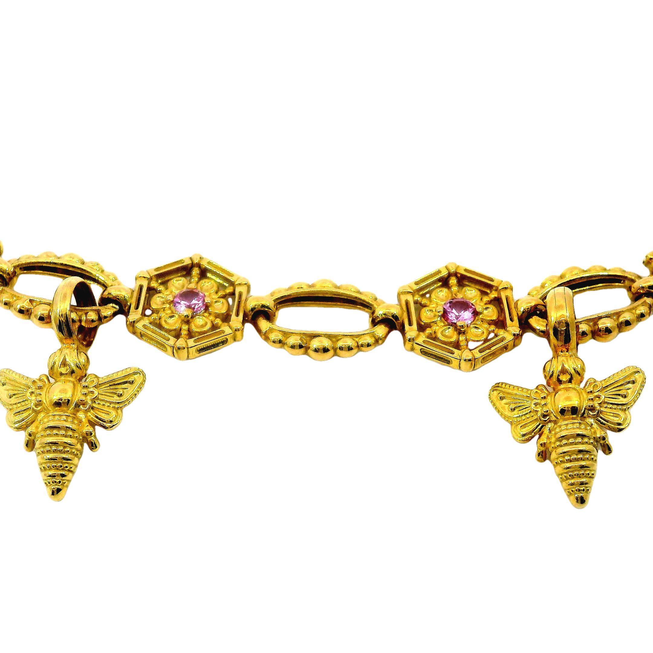 Konstantino 18 Karat Yellow Gold Pink Sapphire and Fire Fly Flower Link Bracelet

Made from 18k yellow gold, this remarkable Konstantino bracelet features hexagonal links, each with a bright pink sapphire in the center. The total weight of the