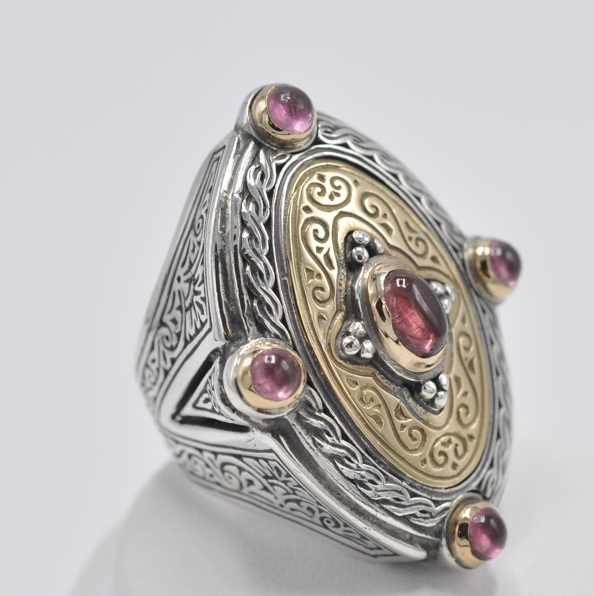 This beautiful example of Konstantino's attention to detail and incredible craftsmanship is a true piece of art. The ring is made of Sterling Silver and 18k Yellow Gold and has roughly 1.25 carats of cabochons of Pink Tourmalines. The ring is
