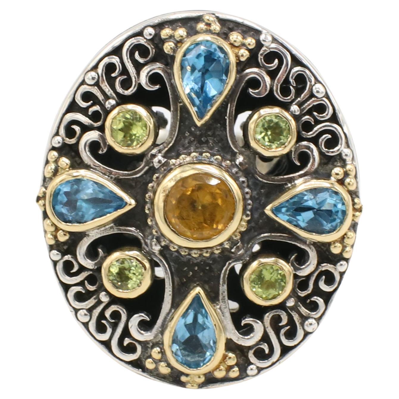 Konstantino Sterling Silver and Gold Multi-Colored Gemstone Ring 
Metal: Sterling silver & 18k yellow gold
Weight: 29.9 grams
Top: 30 x 25.5mm
Size: 7.25 (US)
Gemstones: Citrine, Topaz, Peridot
