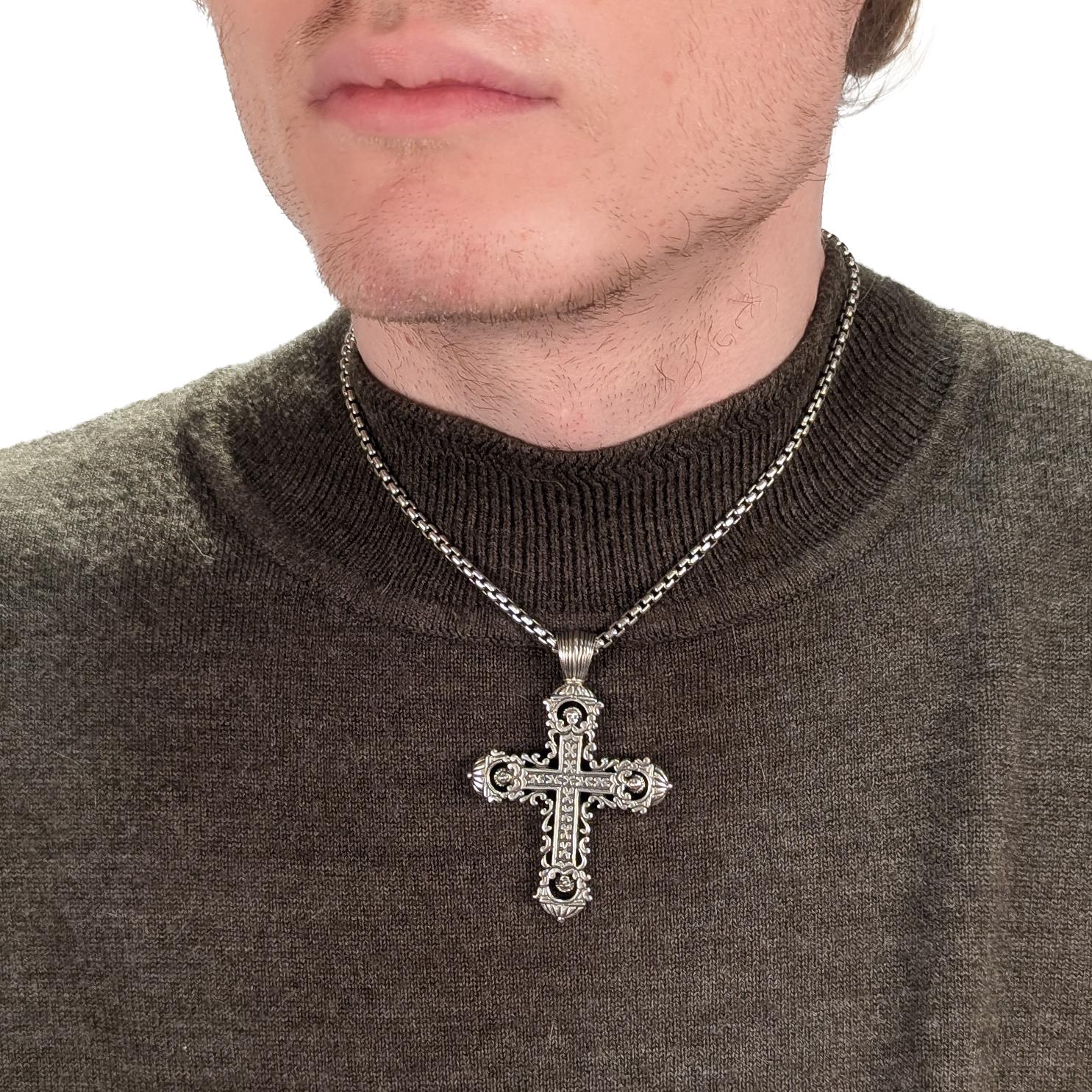 A fine signed silver cross pendant.

By Konstantino, the renowned Greek jewelry house.

In sterling silver.

With small angel's heads within dome terminals at the end of each arm.

Fixed with an integral bail.

Simply wonderful Konstantino