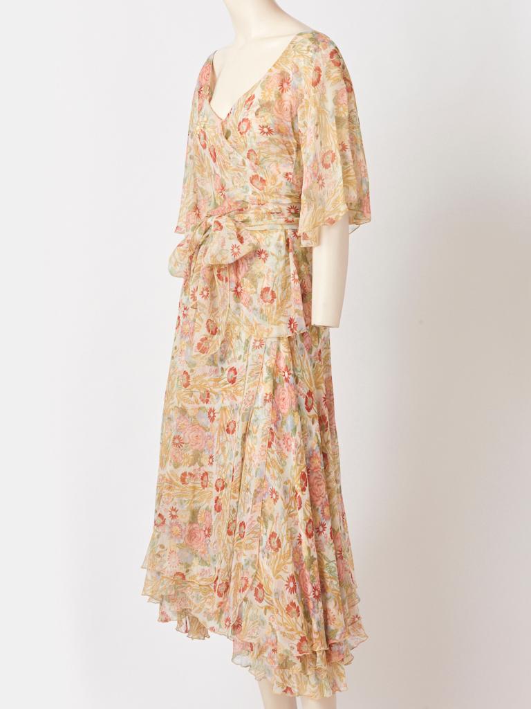 Koos van den Akker, floral, silk chiffon, pastel tone 2 piece dress, having a v neck  wrap top with bell sleeves and a multi layered wrap bias cut skirt. C. 1970's.