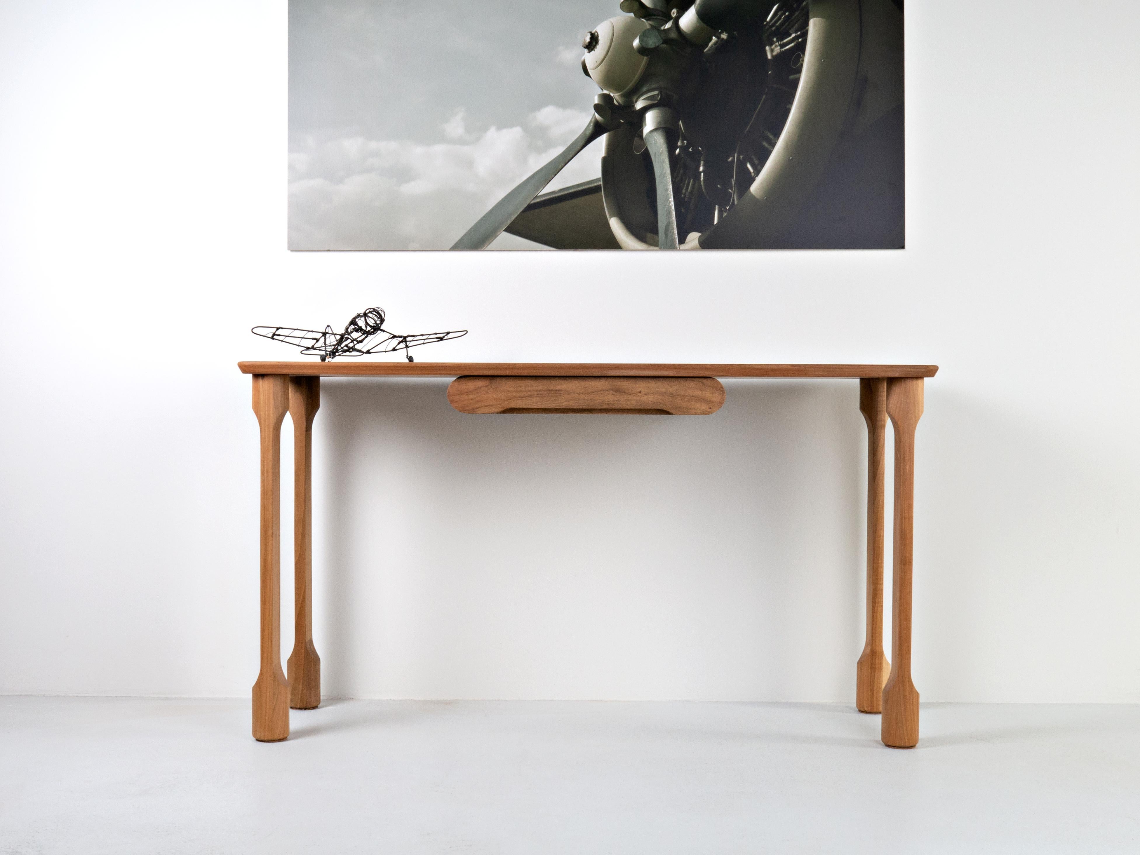 This so-called side table (in the four-legged variant) or console table (in the two-legged variant) fixed to the wall. It can be used as a dressing table in the sleeping area, as a mini desk in smaller spaces or as a kind of chest of drawers in the