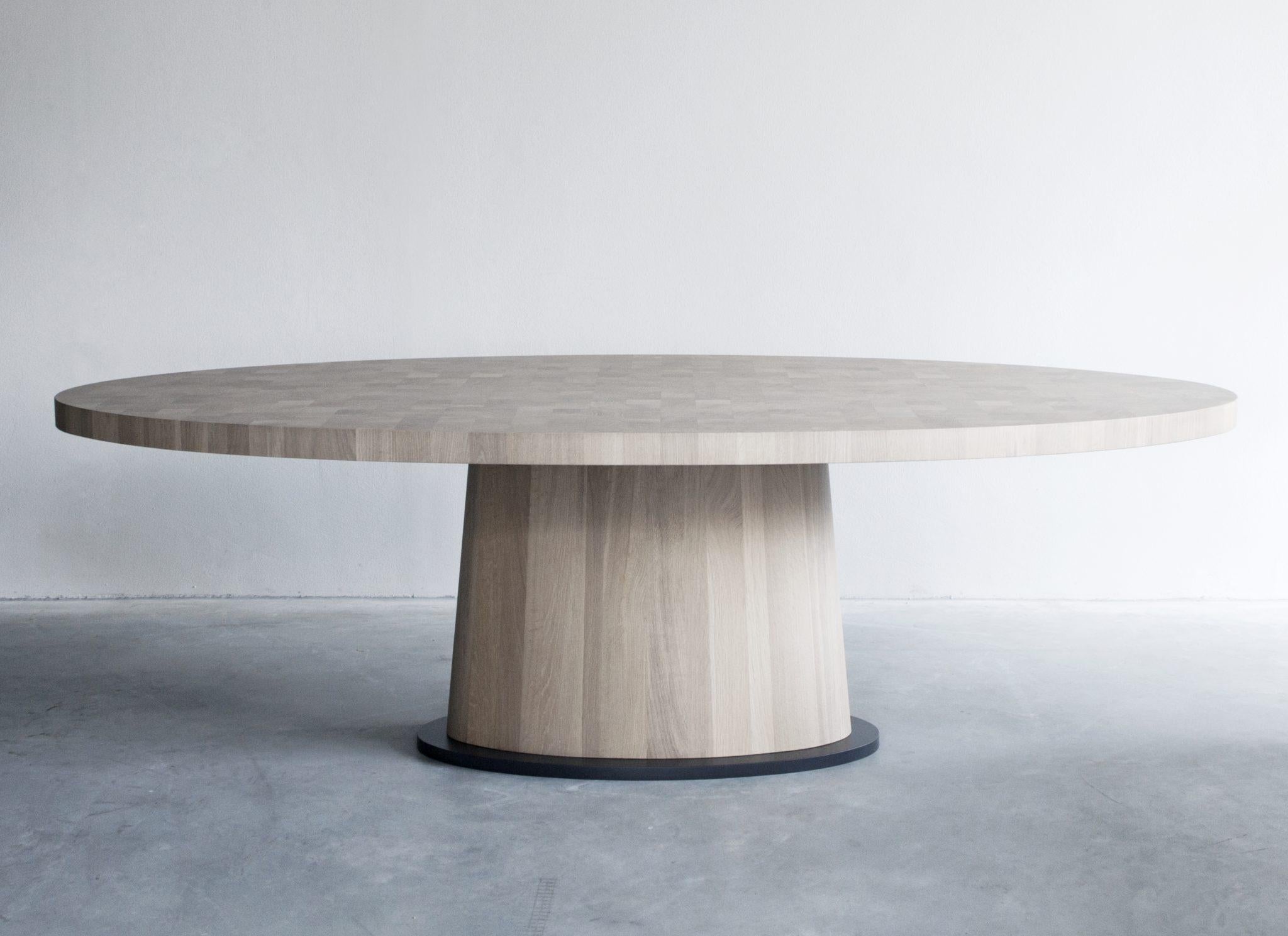 Kops oval table by Van Rossum
Dimensions: D245 x W133 x H75 cm
Materials: Oak, Steel.

The wood is available in all standard Van Rossum colors, or in a matching finish to customer’s own sample.
The steel is available in four colors or in any