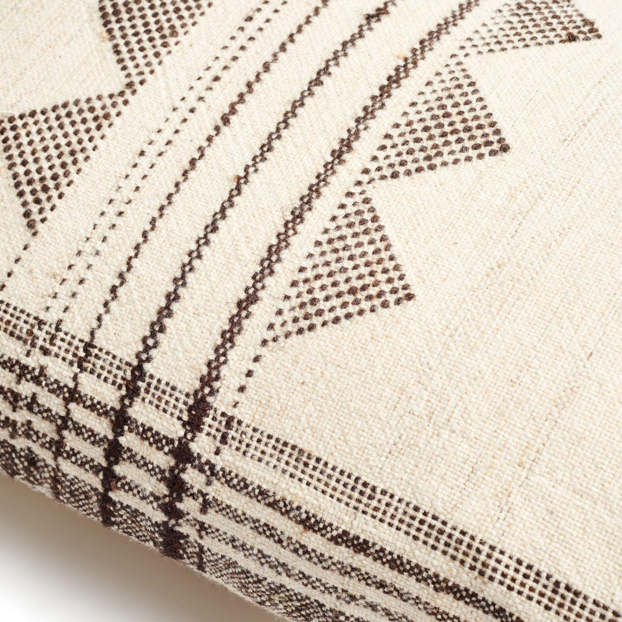 Kora Large Lumbar Pillow is a slightly textured handwoven pillow where our artisans have skillfully blended hand spun yarns like silk, wool and organic cotton. The beauty of this pillow is in its pure design that stands out with the use of undyed