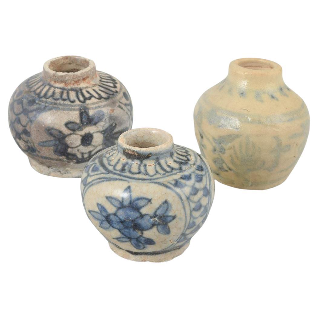 Korea. Set of three small ceramic vases with patterns, 20th C