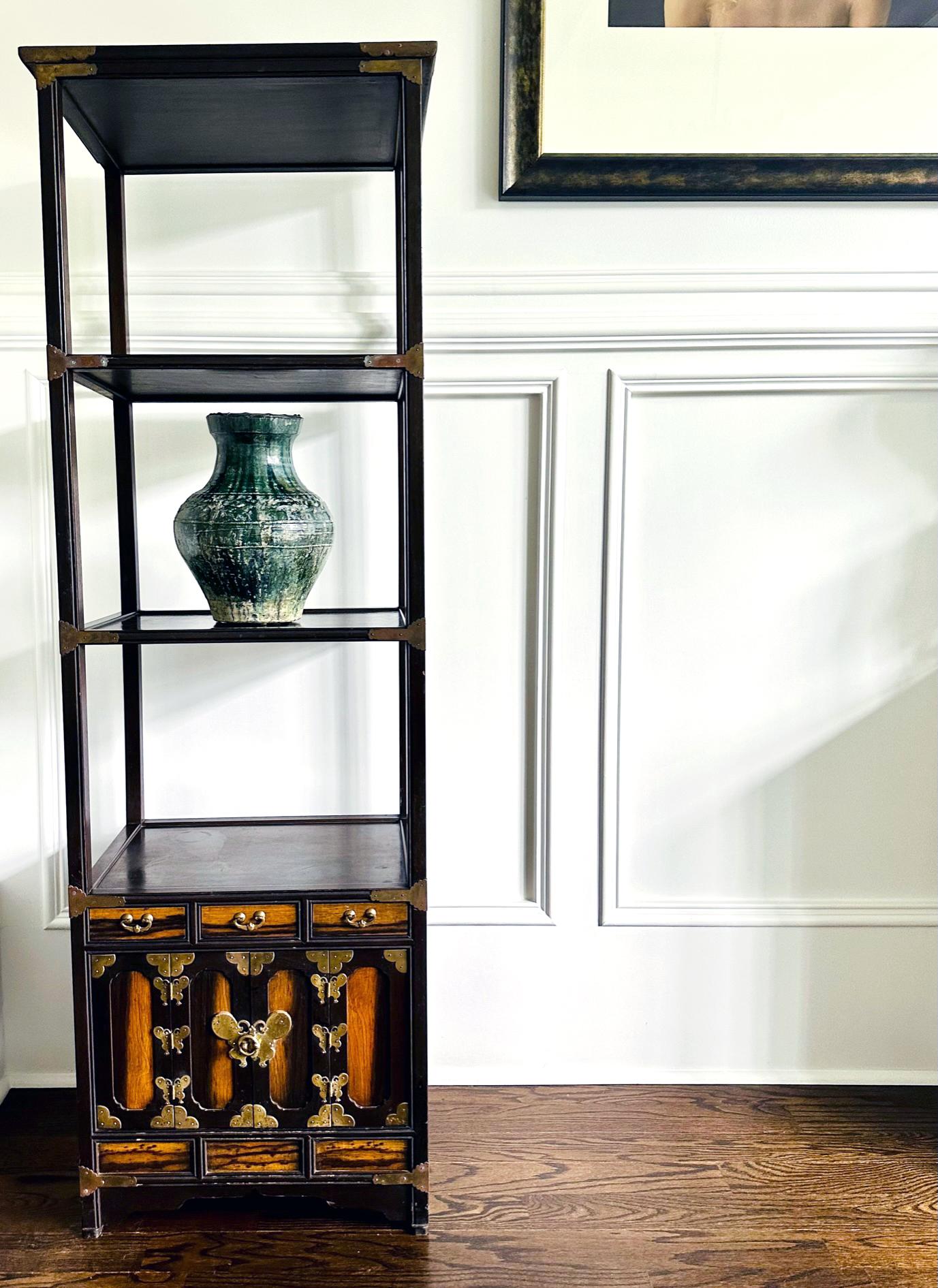 Known in Korean as Sabang Takja (Four-Direction Shelf), this cubic etagere consists of four tiers: three open shelves and the lower storage, which is further divided into a row of three small drawers and a bottom storage space with doors. With its