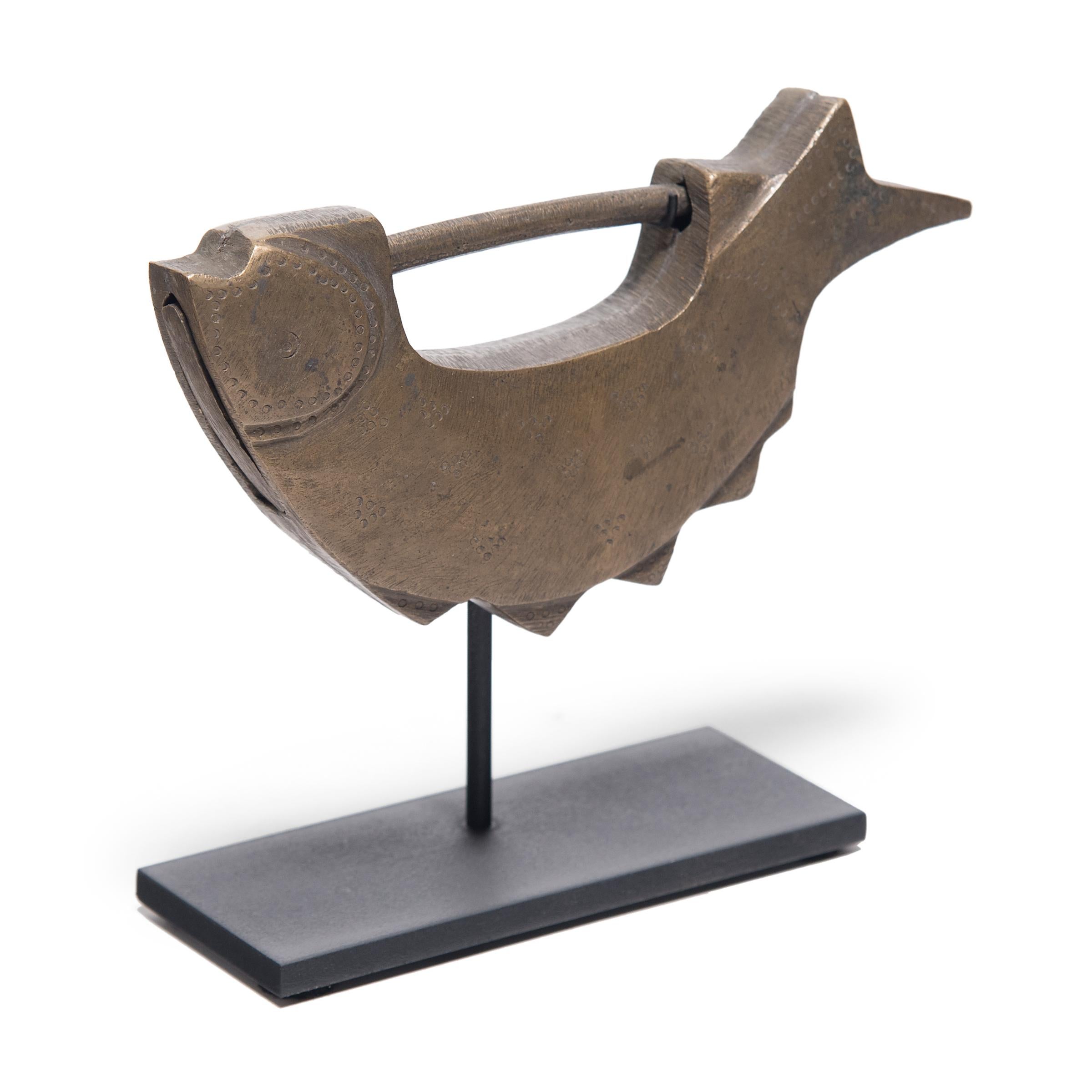 Like the sparkle of a fish’s scales, this 19th century Korean fish lock once brightened the façade of a lacquered cabinet with a flash of golden brass. Demonstrating the aesthetic value placed on even the most everyday items, the handcrafted lock