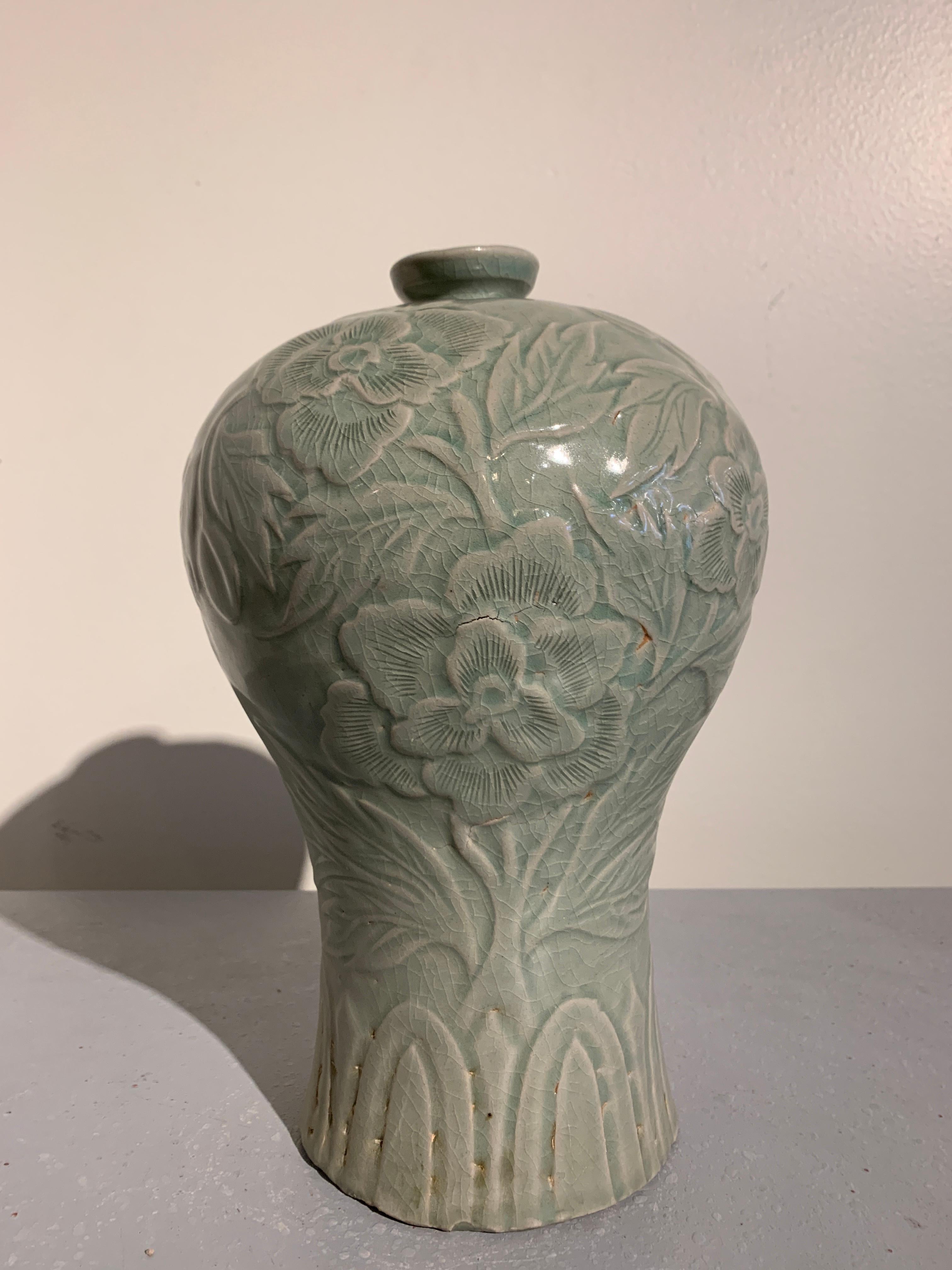 A wonderful Korean celadon vase, called a maebyeong, in the Goryeo style, but of early 20th century manufacture.

The maebyeong vase with a beautiful profile of Classic Chinese meiping form, with a wide, splayed foot, narrow waist, rounded body