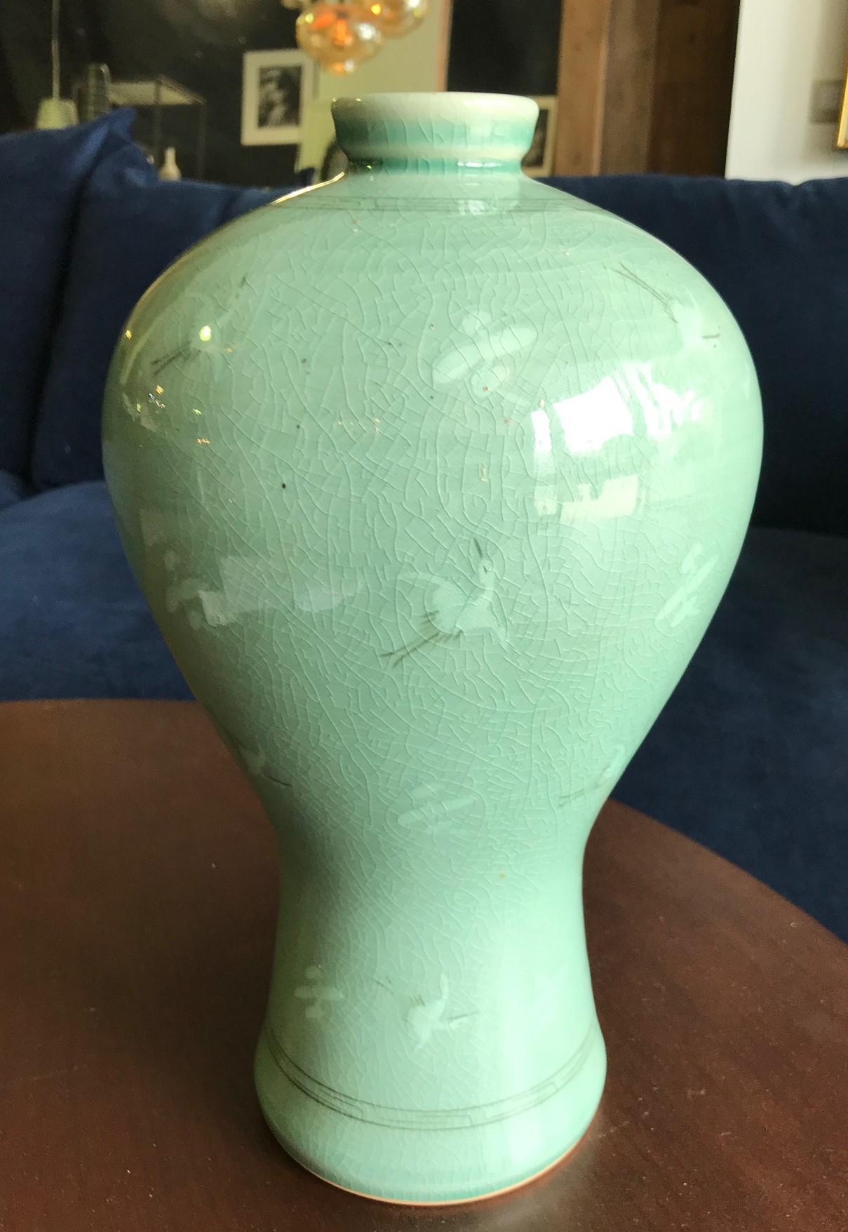 A beautifully colored and decorated (with cranes) Korean crackle glazed vase.

Signed and chop marked or stamped on base.

From a collection of Asian art and antiques.

Would be a nice addition to any Asian art and pottery collection or