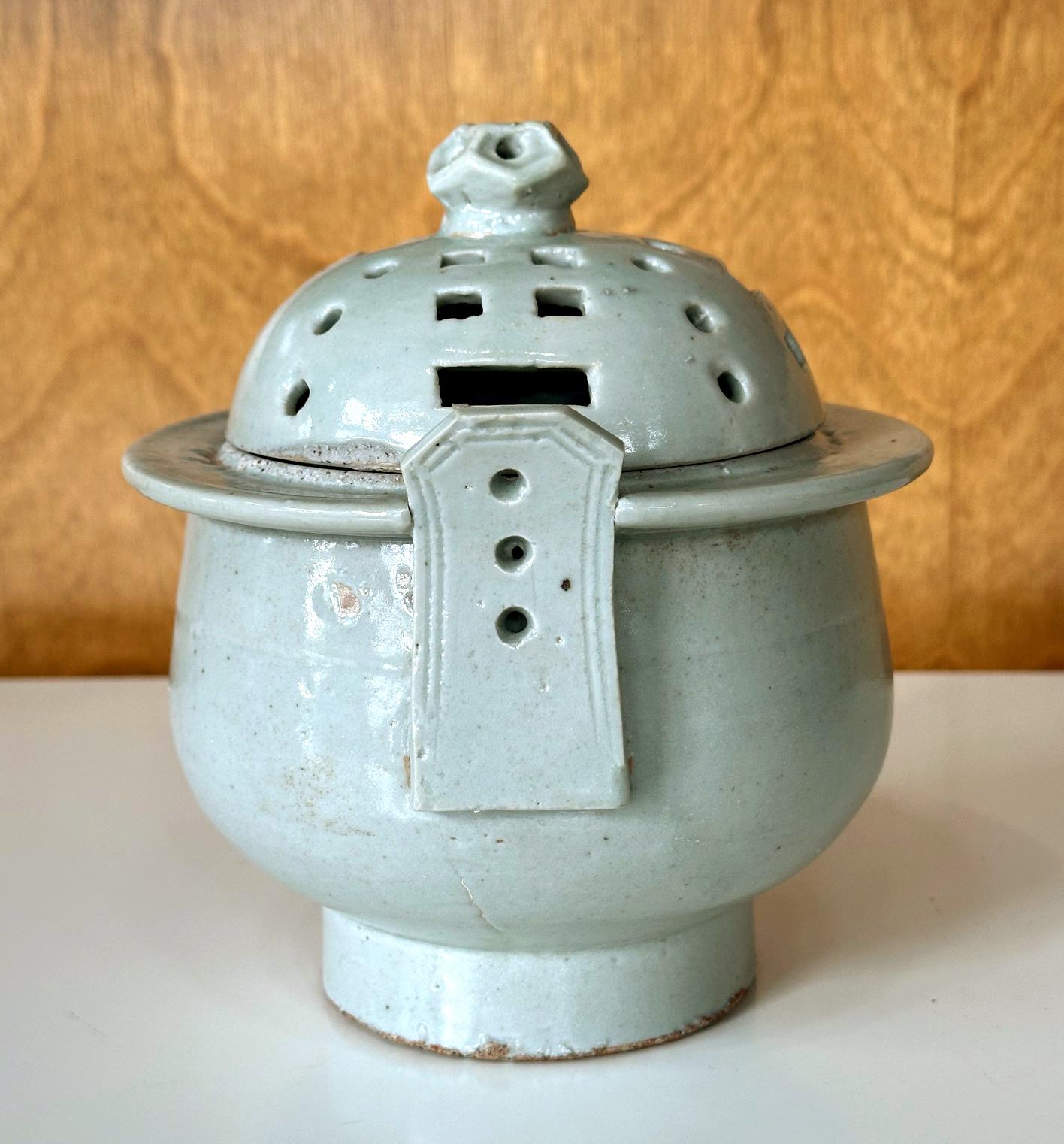 An antique Korean ritual incense burner circa 19th century (late Joseon dynasty). This type of porcelain incense burner was made in Bunwon Kiln in Gwangju, Gyeonggi Do, near Seoul. Used in ceremonial occasions, the vessel was potted in steady and