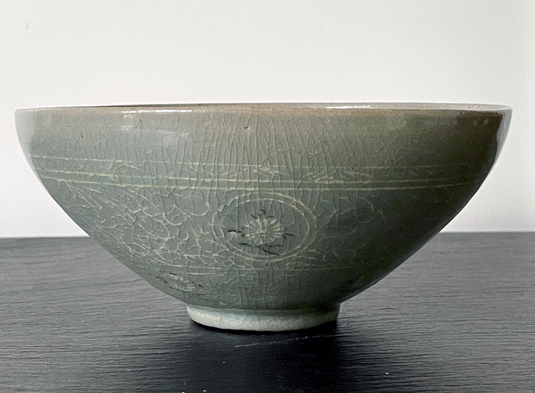 A superb Korean celadon bowl with elaborate slip inlays circa 12th century from the Goryeo Dynasties (918 to 1392AD). Despite inspired originally by the celadons from Song Dynasty in China, the development of celadon in Korean peninsula took its own