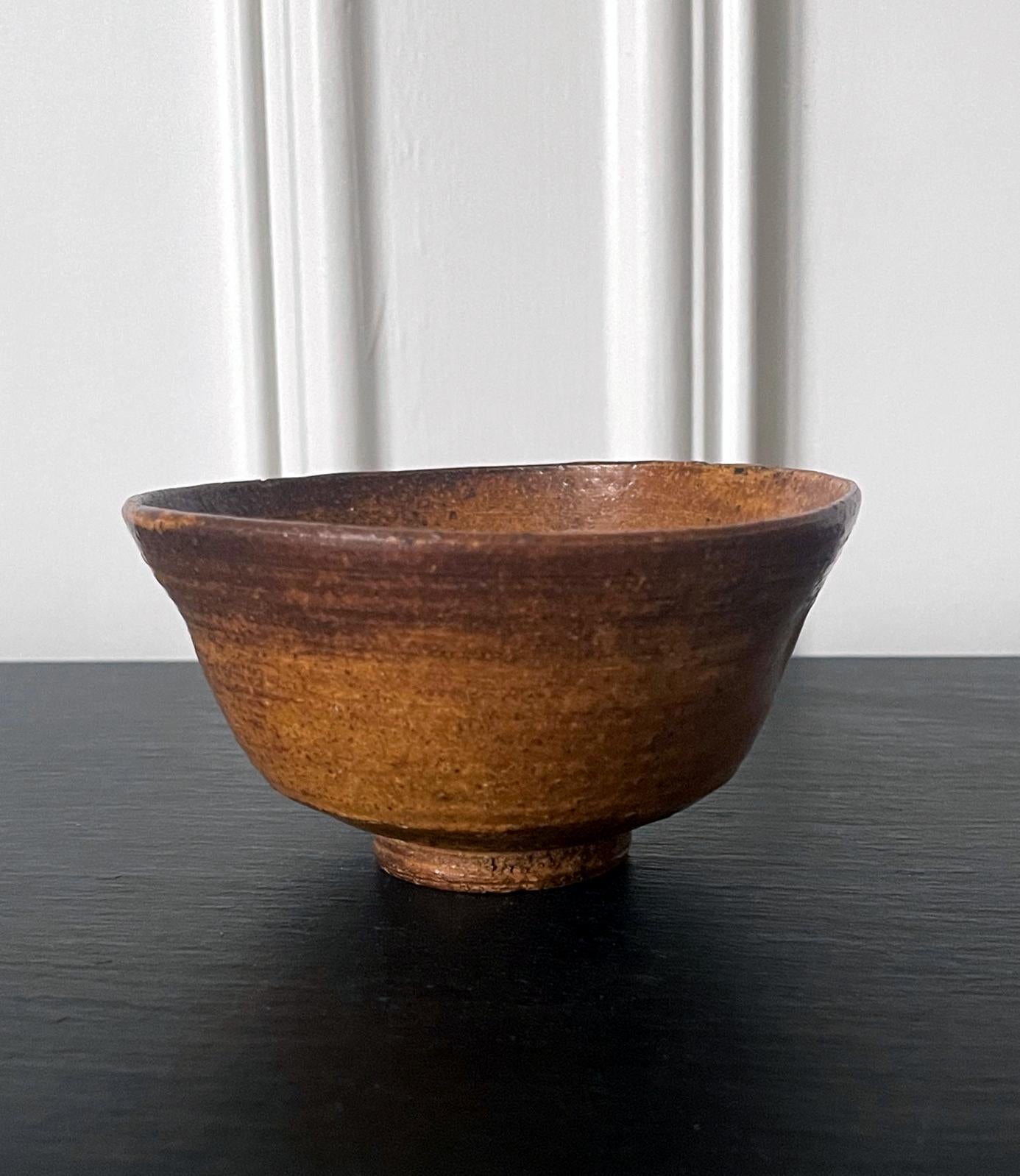 A ceramic chawan tea bowl made in Korea for Japanese market circa 17th century. The chawan is identified as Irabo type. Irabo bowls were essentially considered as a second generation or late period Korean export, made specifically to meet the demand