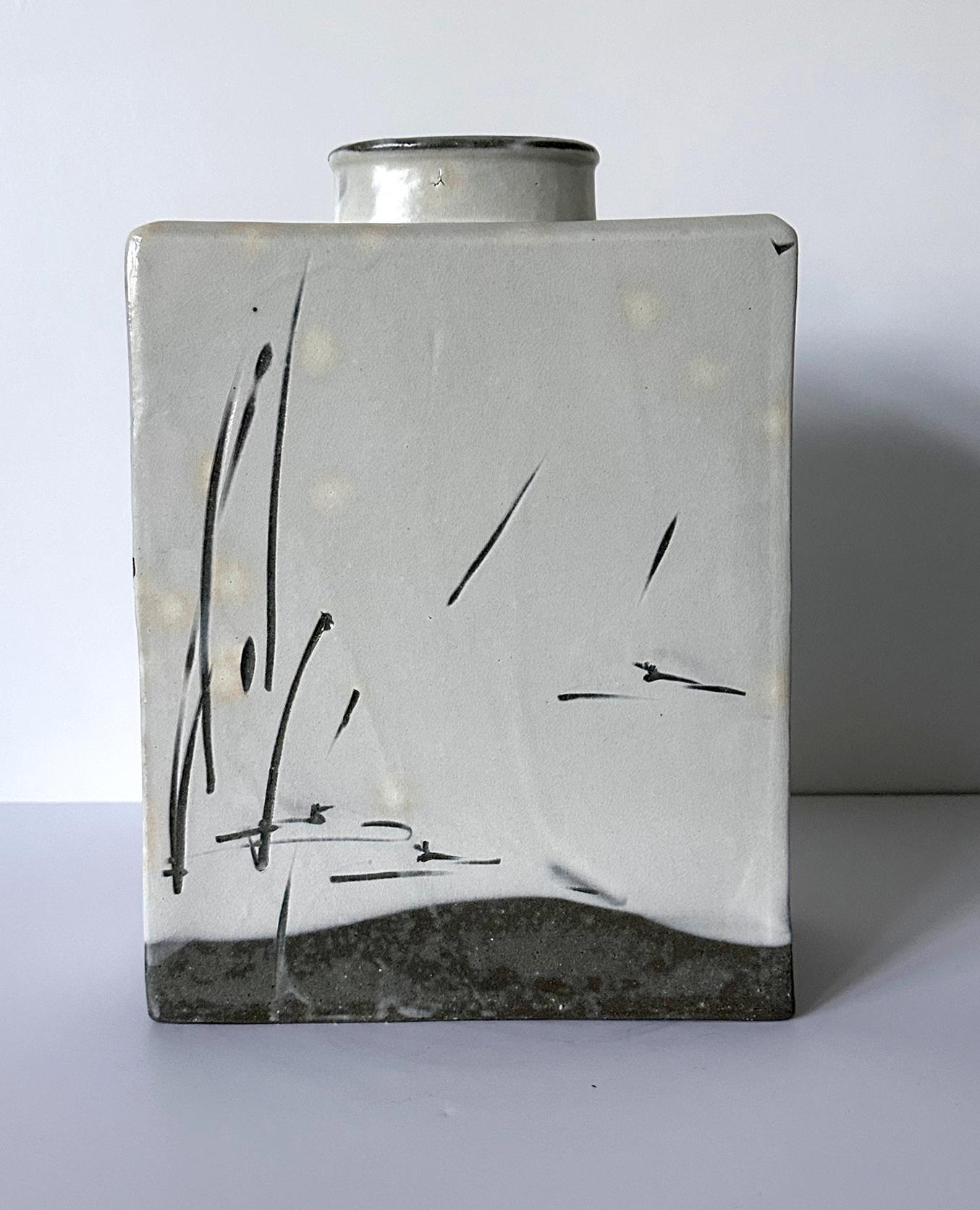 A ceramic rectangular form vase, part of the artist's 