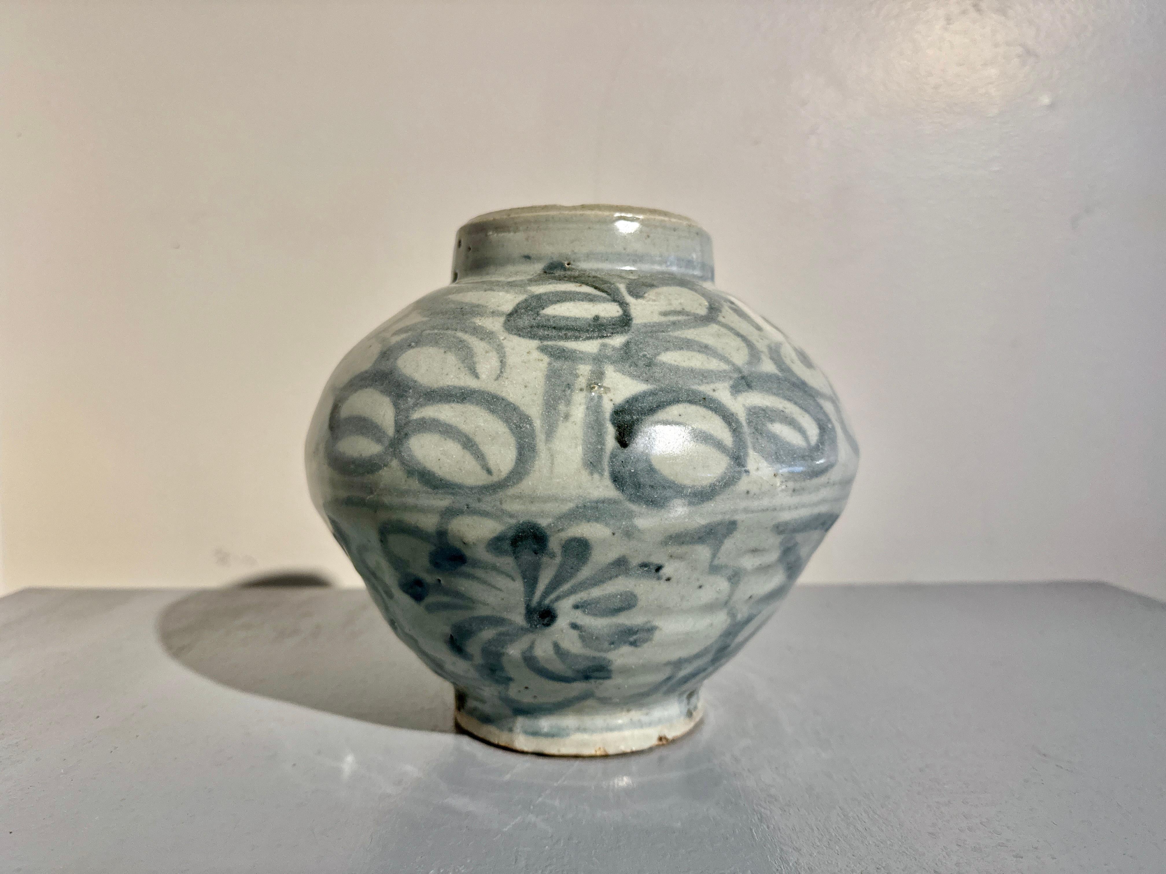A charming Korean blue and white decorated porcelain jar, Joseon Dynasty, 18th/19th century, Korea.

This jar exudes character. The squat and slightly irregular shaped jar is formed in the traditional Korean technique in which two hemisphere joined
