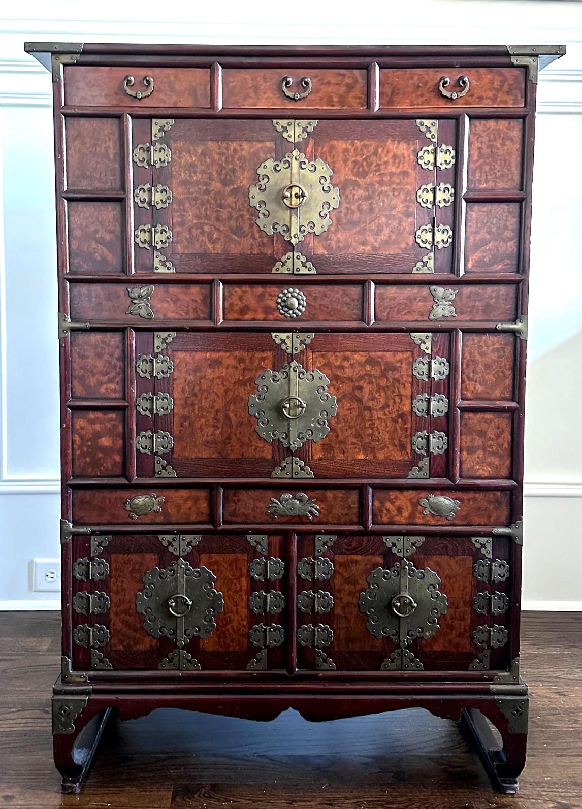 Traditionally presented at the wedding ceremony of a wealthy household, this tri-level tall storage chest (Samcheung Jang) was intimately known as “mandarin duck” cabinet in Korean. The name refers to the special feature on the bottom level where a