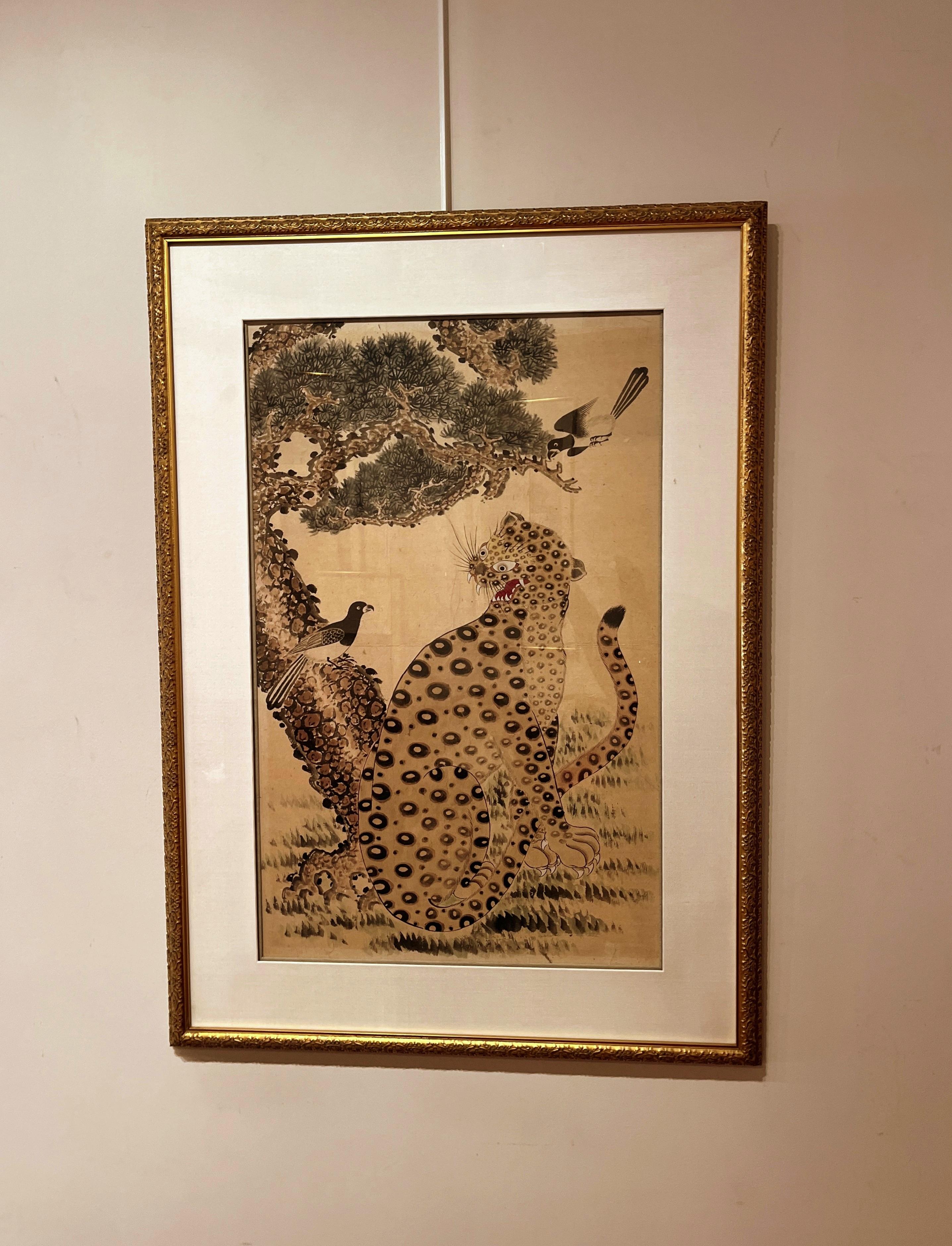 Korean Minhwa Spotted Leopard Snarling Magpie and another Magpie flying in the pine tree
 Minhwa, Korean folk paintings, portray the simple and unaffected daily lives of ordinary people. An invaluable part of Korea's cultural heritage, folk