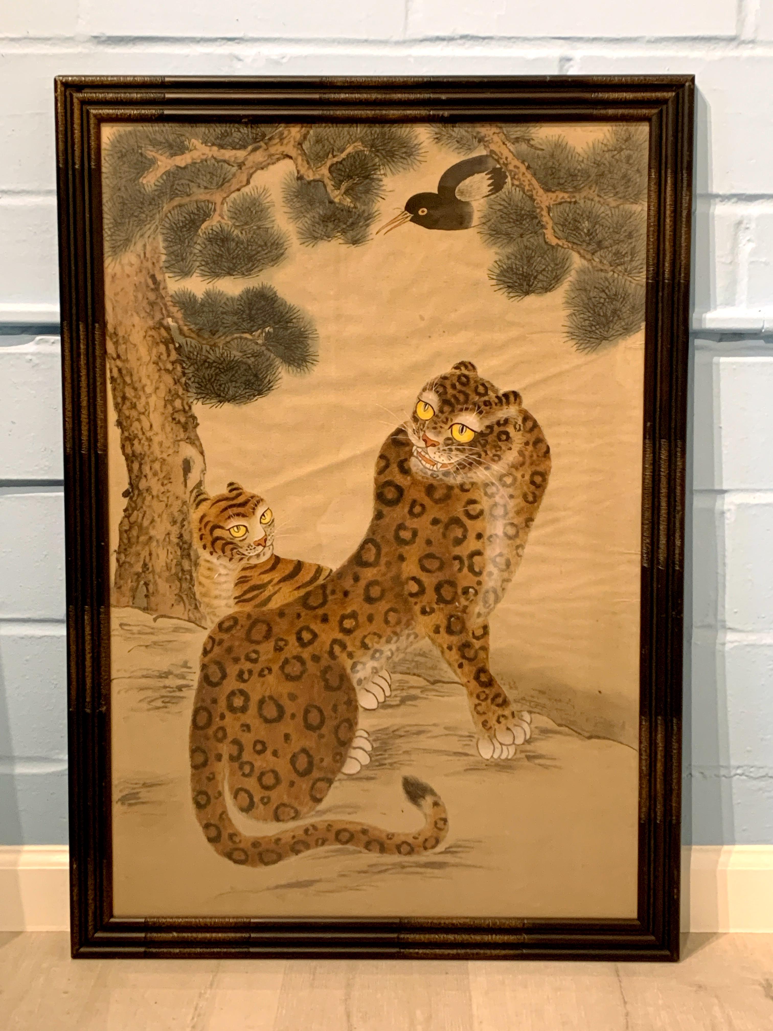 A wonderfully charming Korean Minhwa Jakhodo painting on silk of a spotted tiger with her cub under a pine tree, a magpie in the branches above them, Joseon Dynasty, late 19th century. 

The traditional Korean folk painting (minhwa) of ink and
