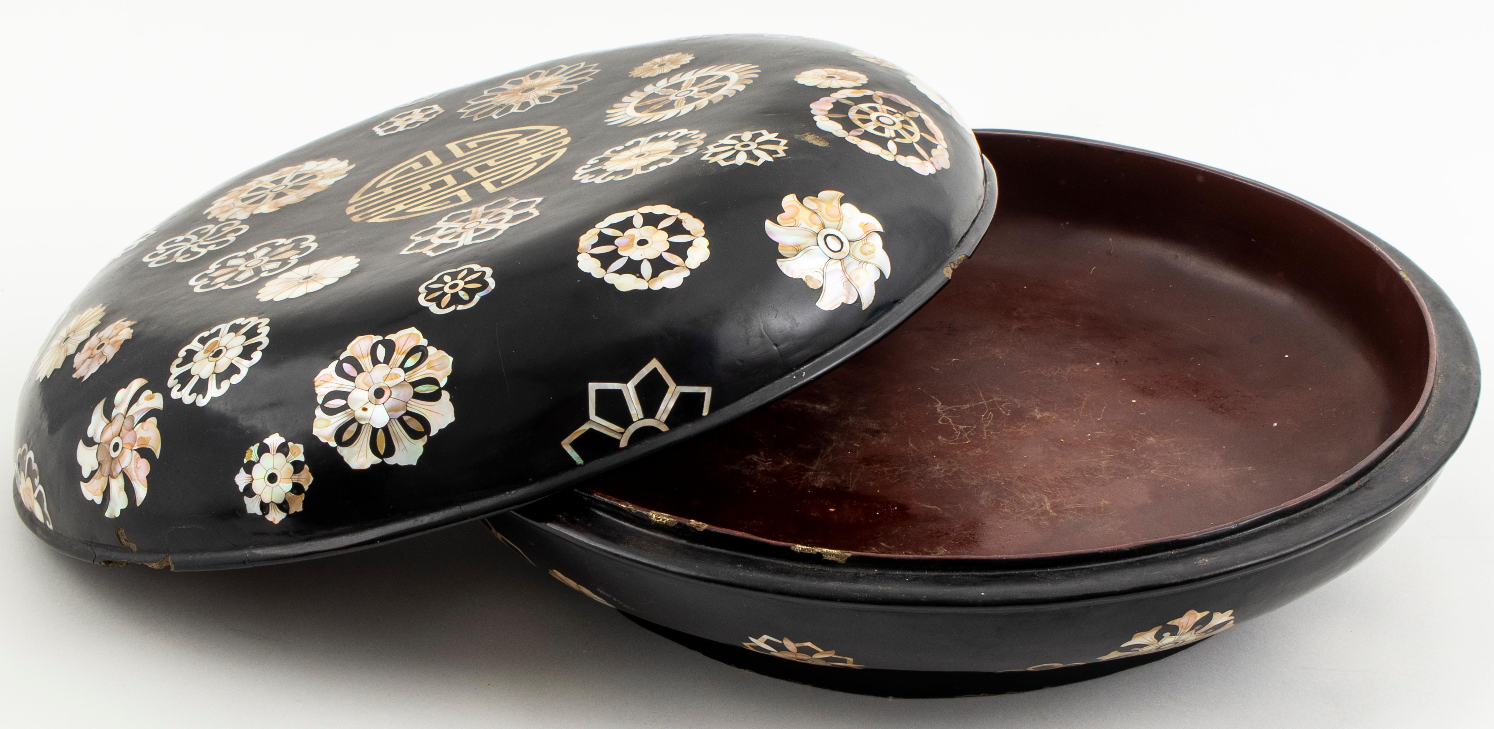 Korean shell inlaid hardwood covered bowl, overall with mother-of-pearl medallions and symbols. 5.75” H x 15.5” diameter. Removed from a private residence at the Pierre Hotel in New York City.