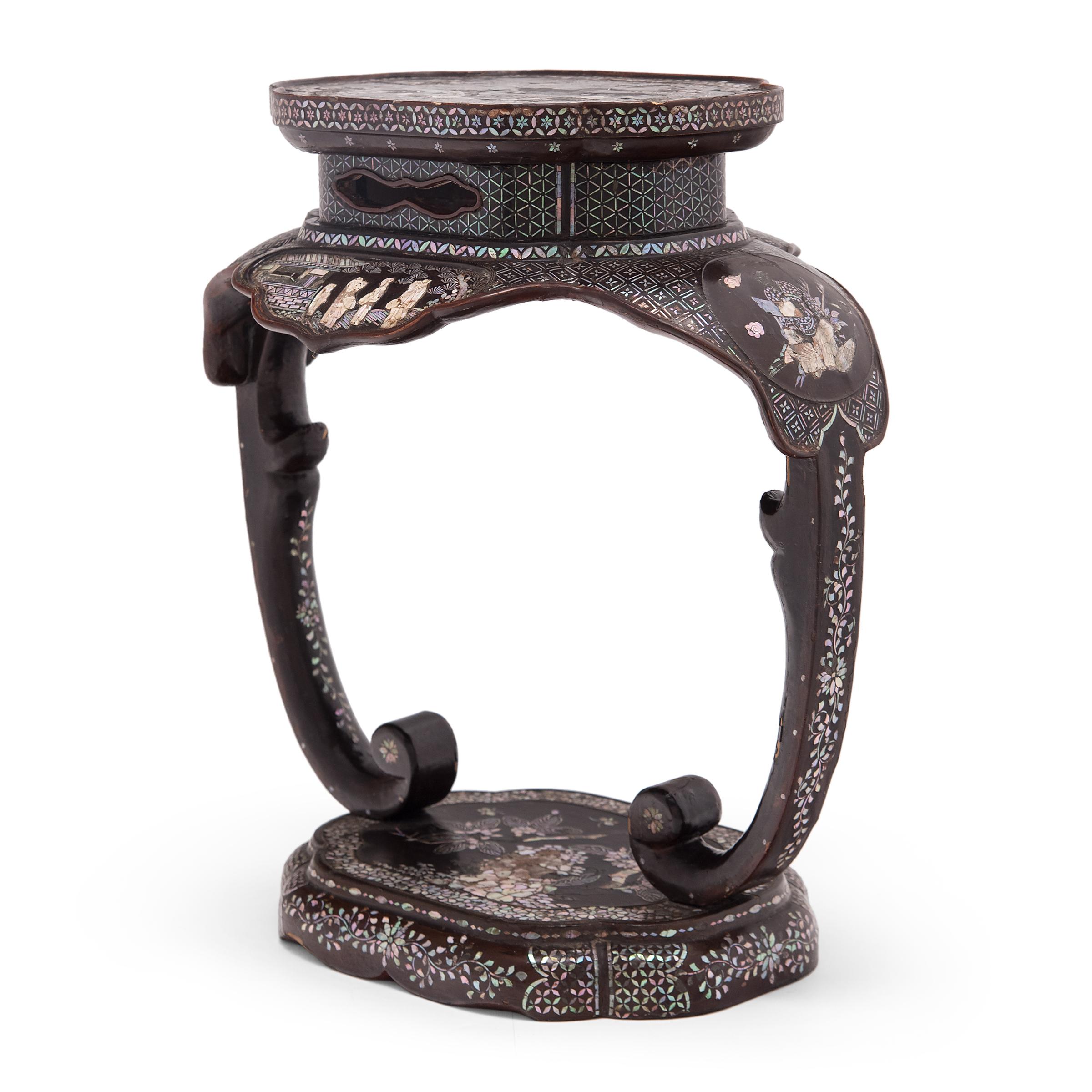 This ornate Korean stool was crafted in the early 20th century of lacquered papier-mâché with beautiful mother-of-pearl inlay, a decorative technique known as 