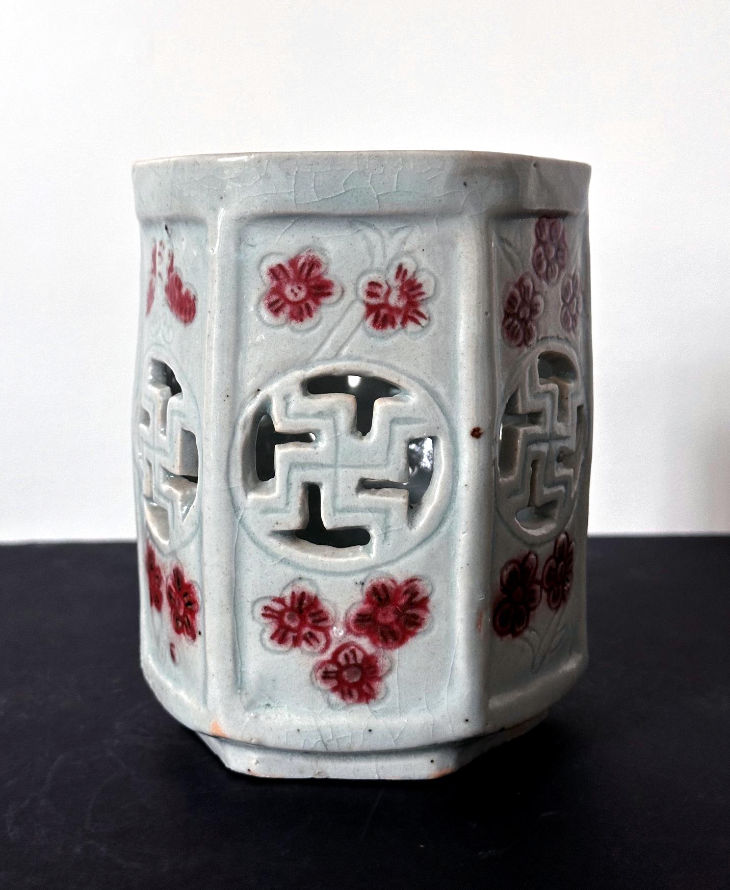 A Korean porcelain brush holder in hexagon form from the end of Joseon dynasty circa late 19th century. Cherished by the scholars, brushpot like this would grace the desk in the man's study. Covered in an overall bluish celadon glaze, each of the