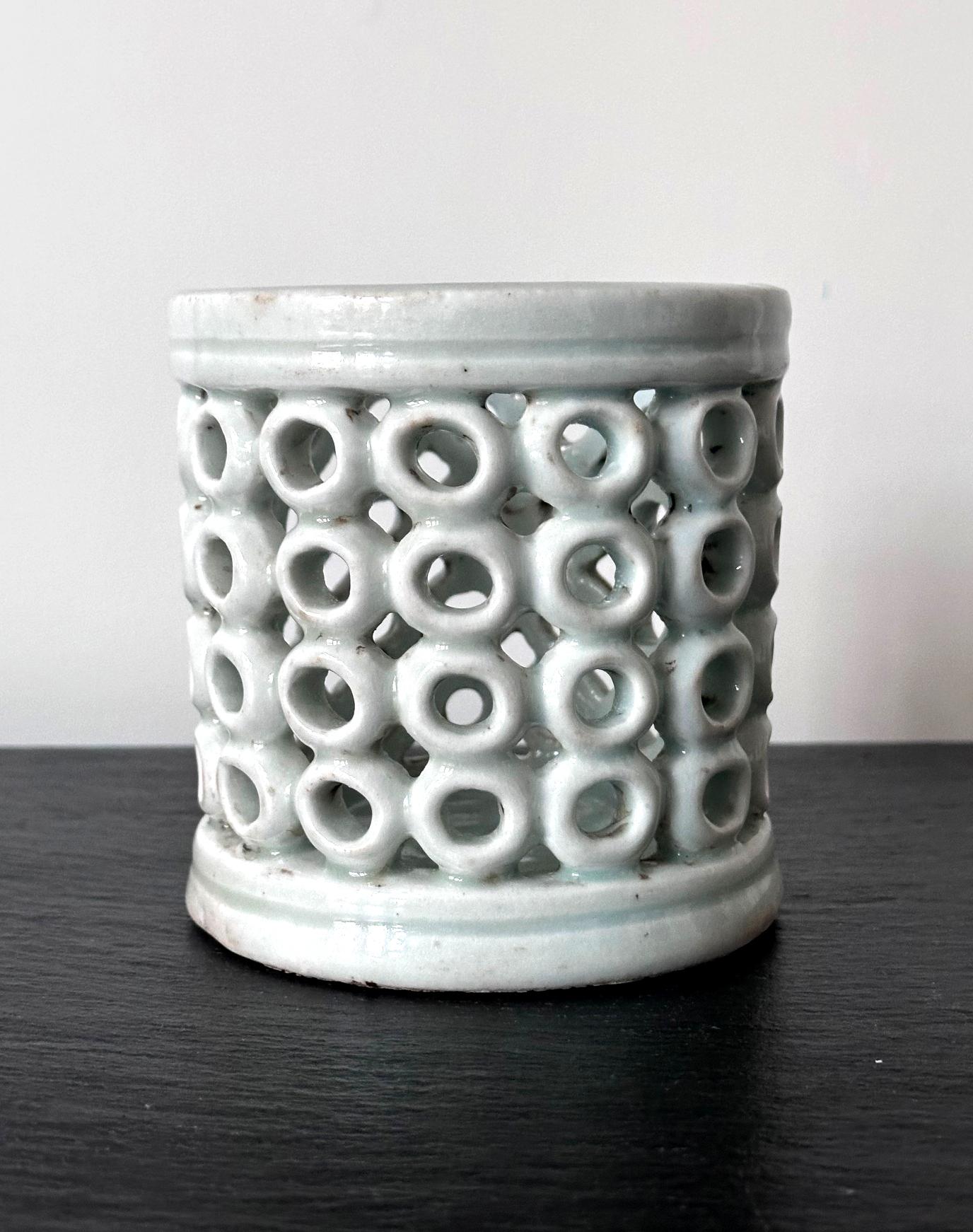 A Korean porcelain brush holder in cylinder log form from the end of Joseon dynasty circa late 19th century. Cherished by the scholars, brush pot like this would grace the desk in the man's study and used to hold the collection of the brush pens.