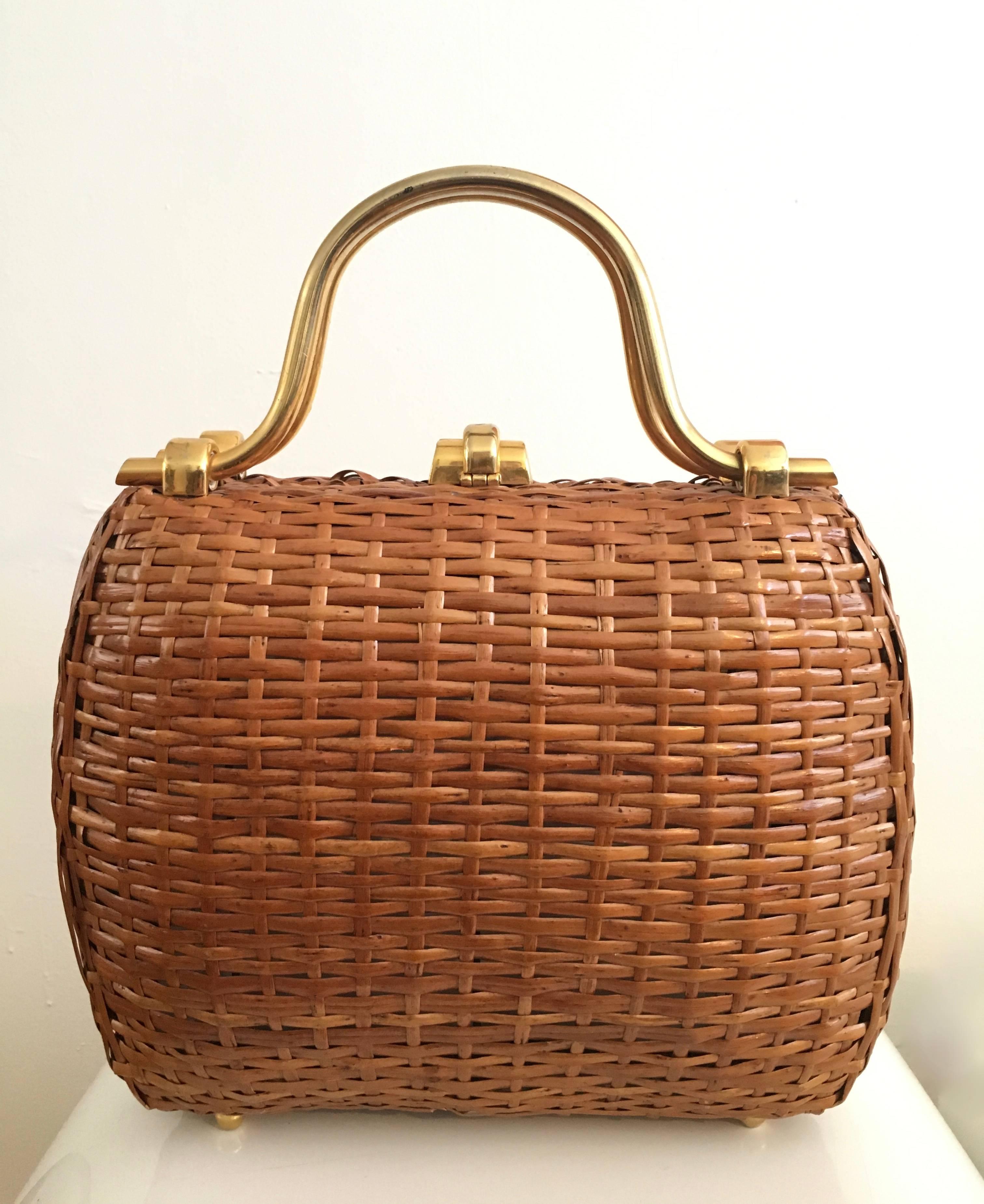Koret 1950s woven wicker / reed basket handbag with brass handles and clasp made in Italy.
Gorgeous mid century design that is just as stylish today as the day it was conceived. This handbag is in very good vintage condition for a senior citizen,