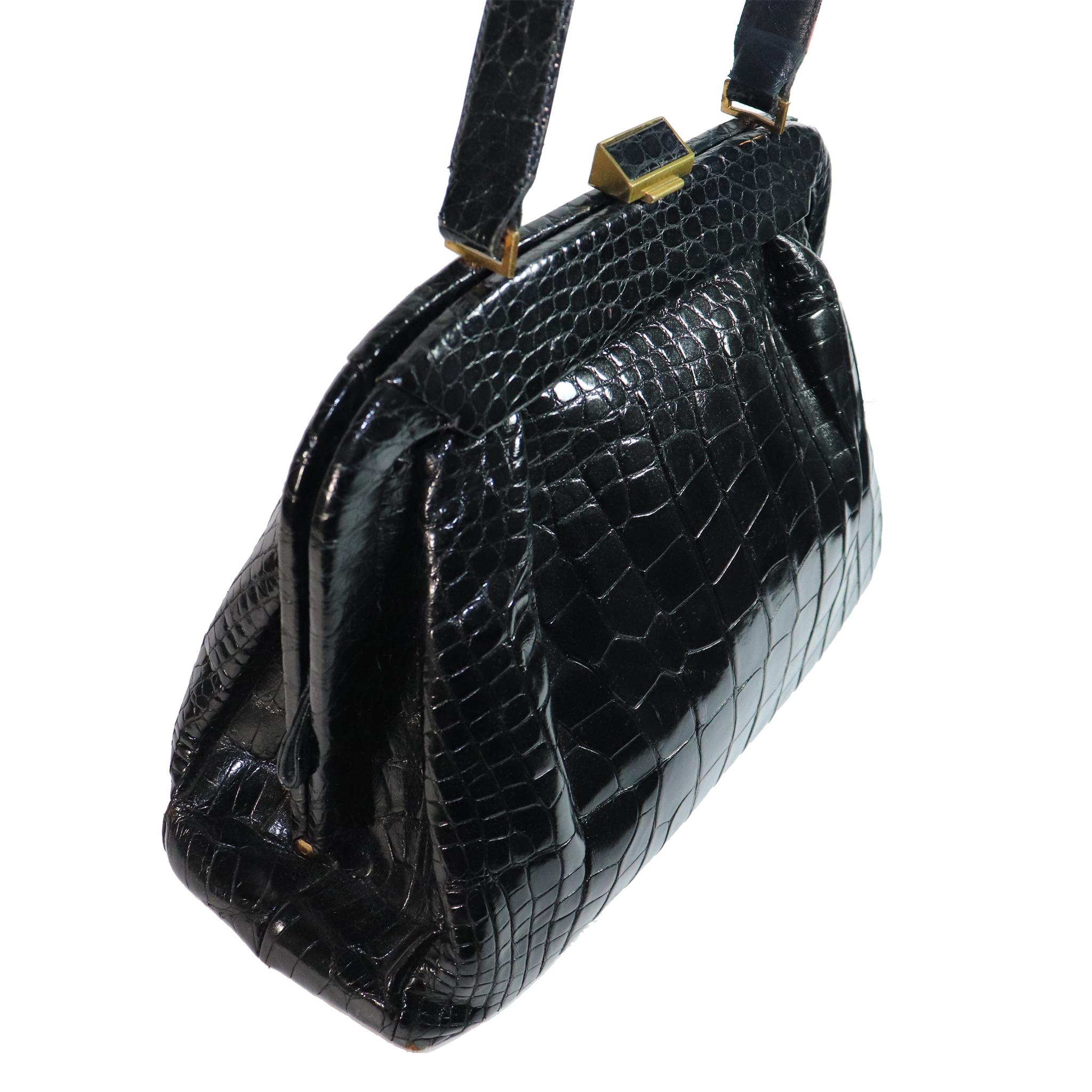 Koret Black Alligator Large Top Handle Bag made in America, comes with attached coin purse and a Kent London pocket Comb.
VERY RARE  

Measurements:

Height - 9.5 inches 
Width - 15 inches 
Height with Strap - 16.2 inches 