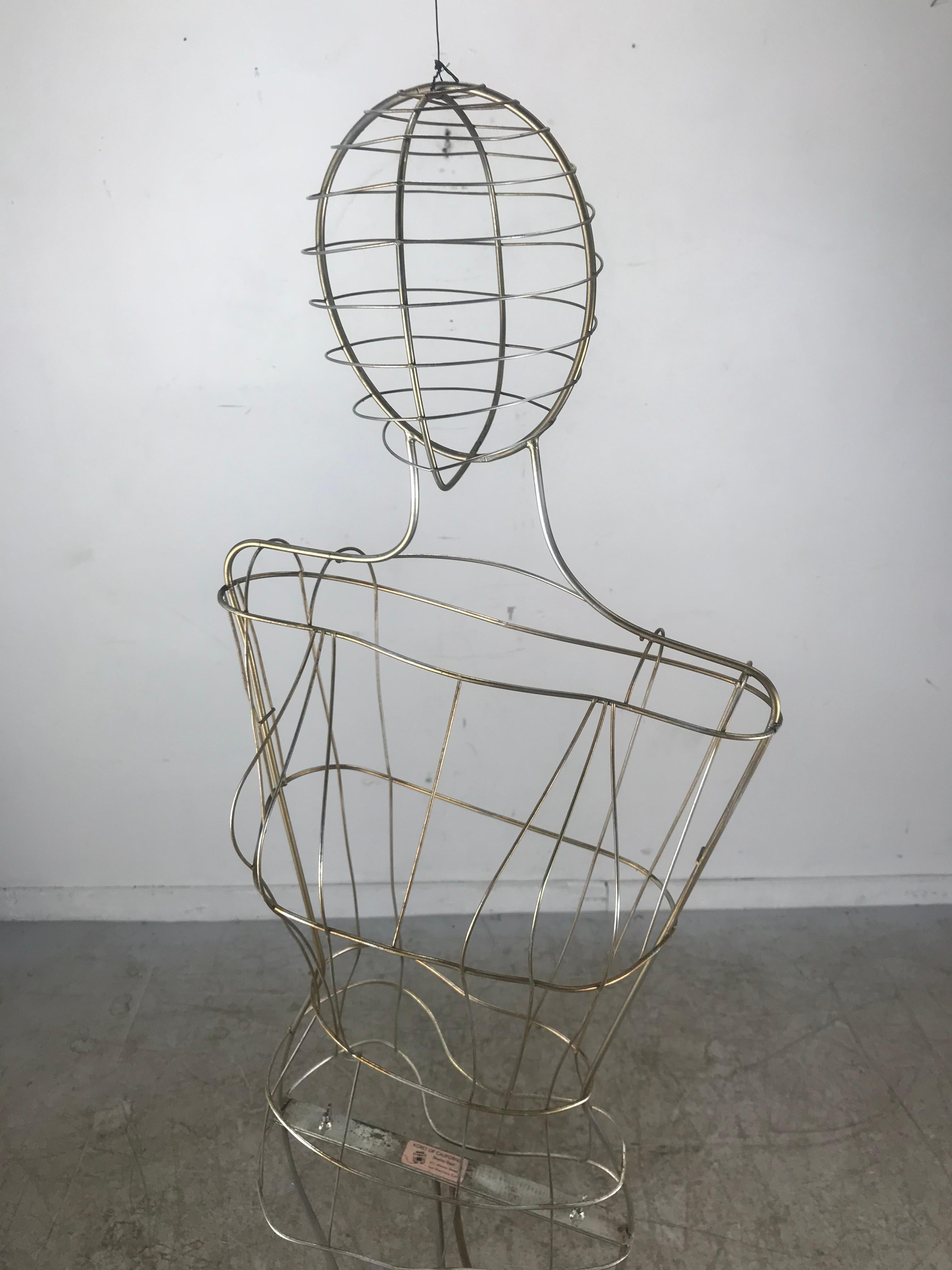 Koret of California stylized wire mannequin or store display, manner of Calder, amazing sculptural design, retains original label. Makes a wonderful hanging kinetic sculpture.