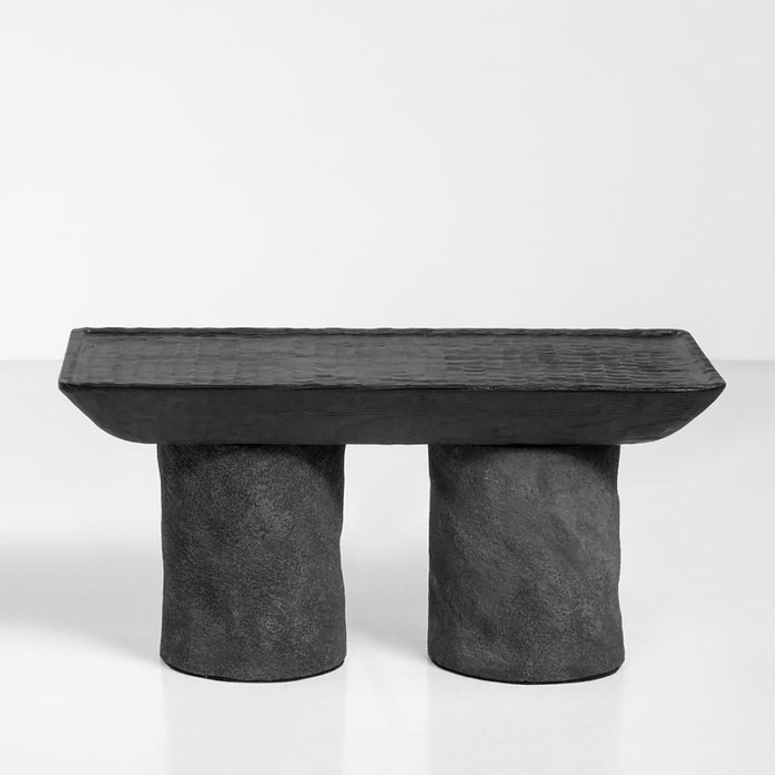 Korotun coffee table by Faina.
Design: Victoriya Yakusha
Materials: clay, wood.
Dimensions: W 75 x D 42 x H 35 cm.

Almost carved in stone, minimalist coffee table with sharp outlines has sturdy character. With its authentic features Korotun—