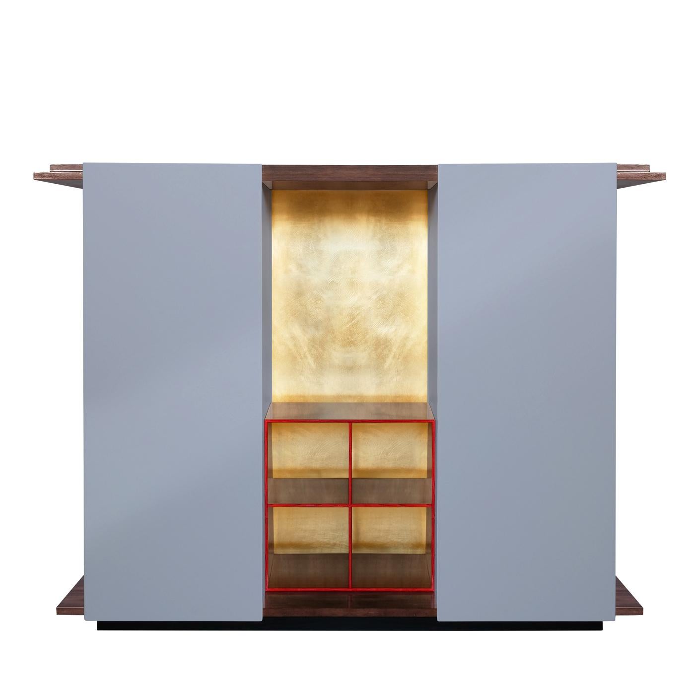 This cabinet boasts a majestic allure that will make a statement in any interior. An example of masterful craftsmanship, it is composed of two doors and five open shelves among which the top one can function as a TV Stand. The elongated base and