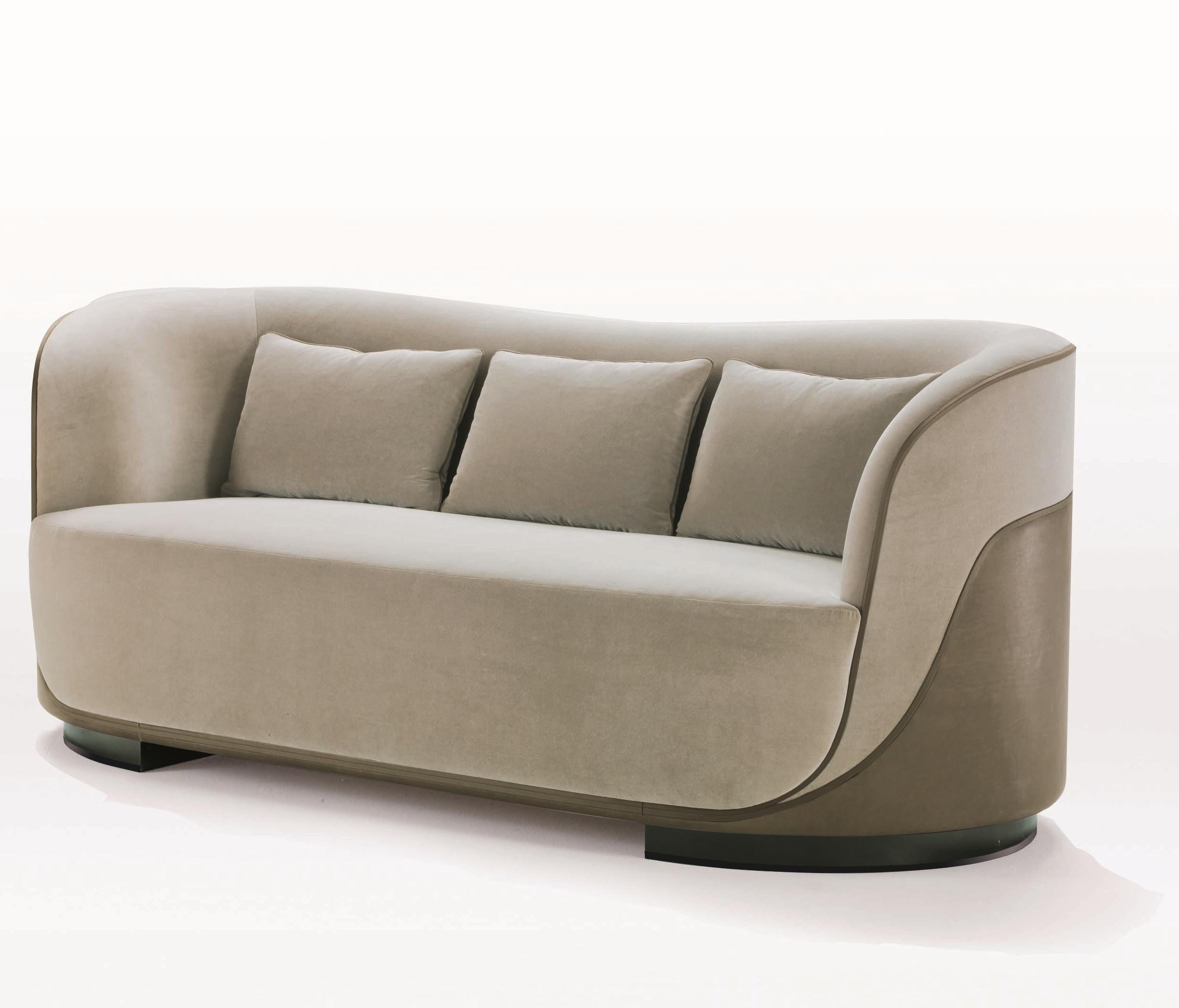 K-Sofa Upholstered in Rubelli 'Spritz' fabric range, colour Argilla and in 'Breva' leather range, colour Creta with piping in Kieffer by Rubelli 'Gabardine' fabric range, colour Bois.
Polished black nickel feet.
Measures: cm. 210W*90D*83H.
 