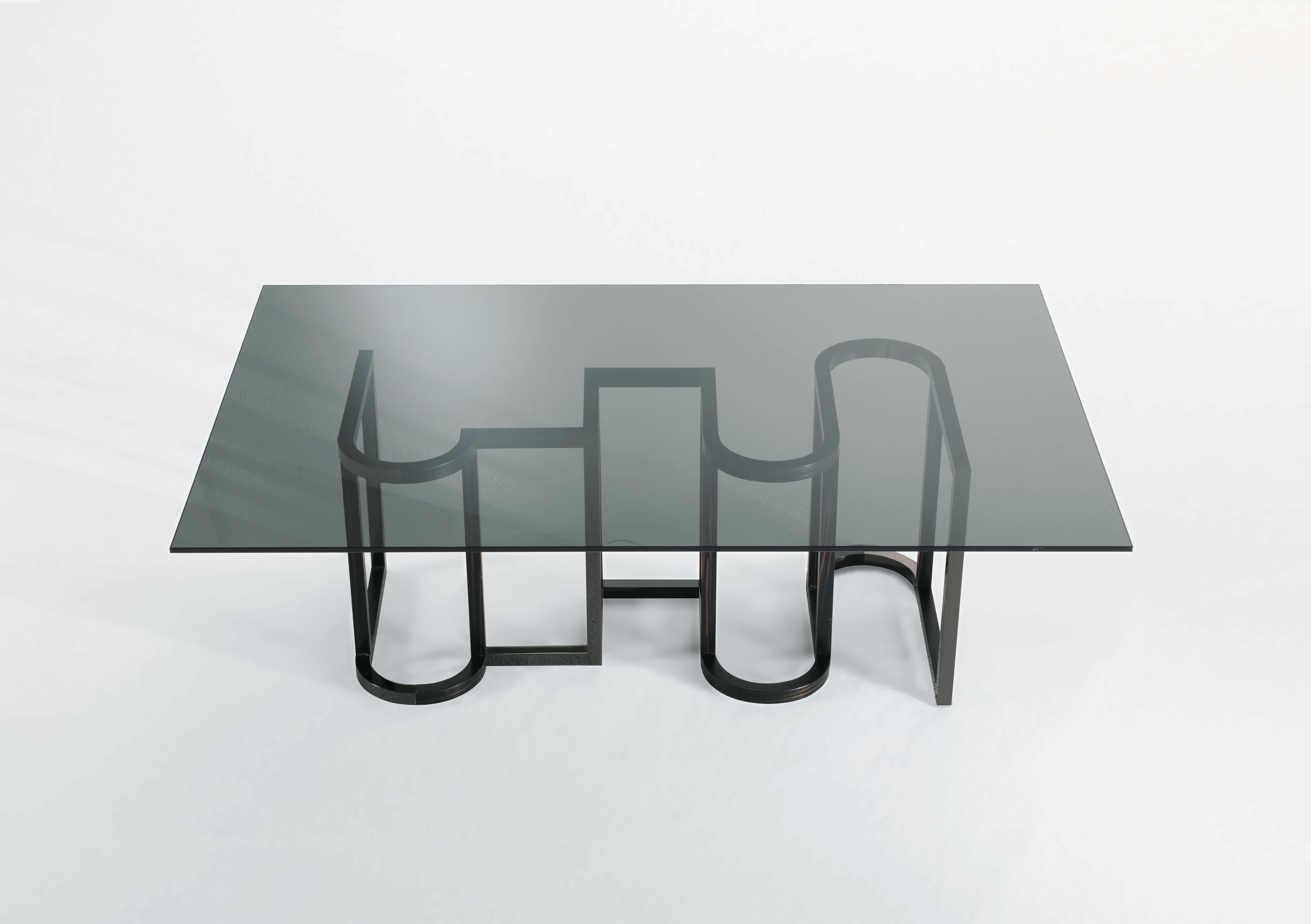 K-Coffee table - Grey smoked glass top, dark stained Ebony matt finish and polished black nickel base.
cm. 140 W x 90 D x 45 H.
 