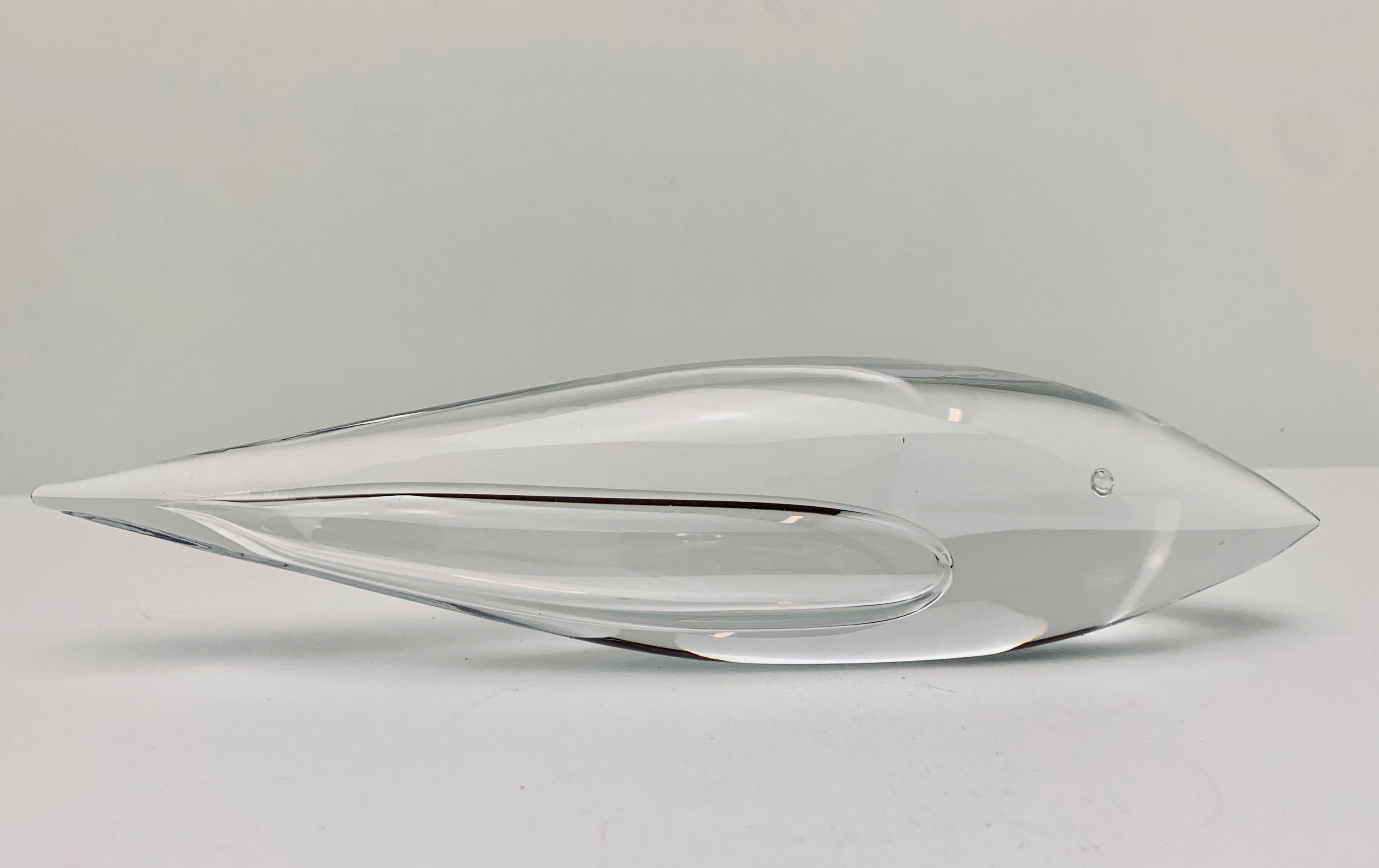 Kosta Boda of Sweden created a series of abstract clear art glass animals. This particular piece is a whale and was created and designed by Vicke Lindstrand who worked for Kosta Boda from 1950-73.  Cleverly an air bubble was placed in the front to