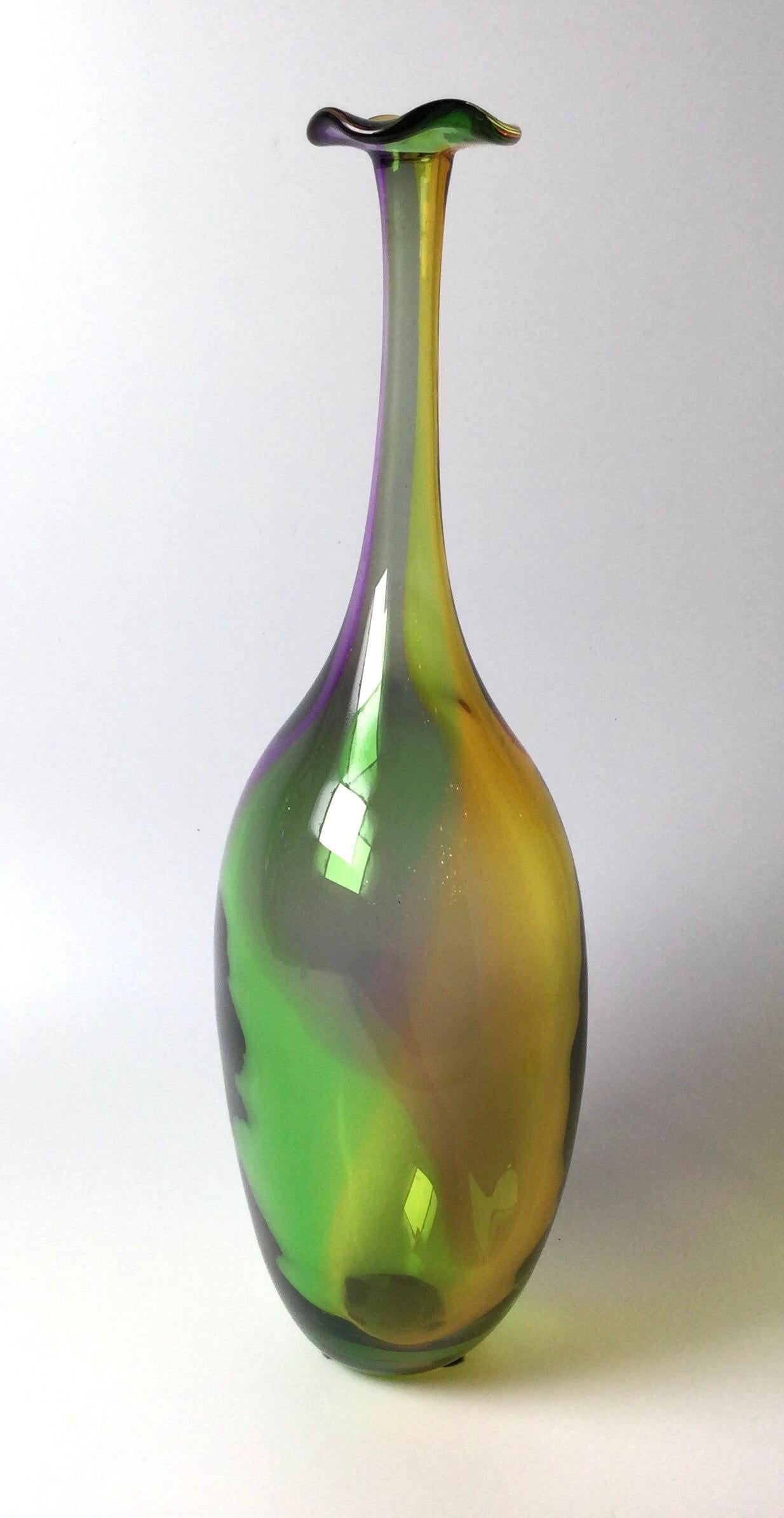 Beautiful blown glass colors of the rainbow tall glass vase. Marked Kosta Boda and signed by the Artist. Kjell Engman. Measures: 18